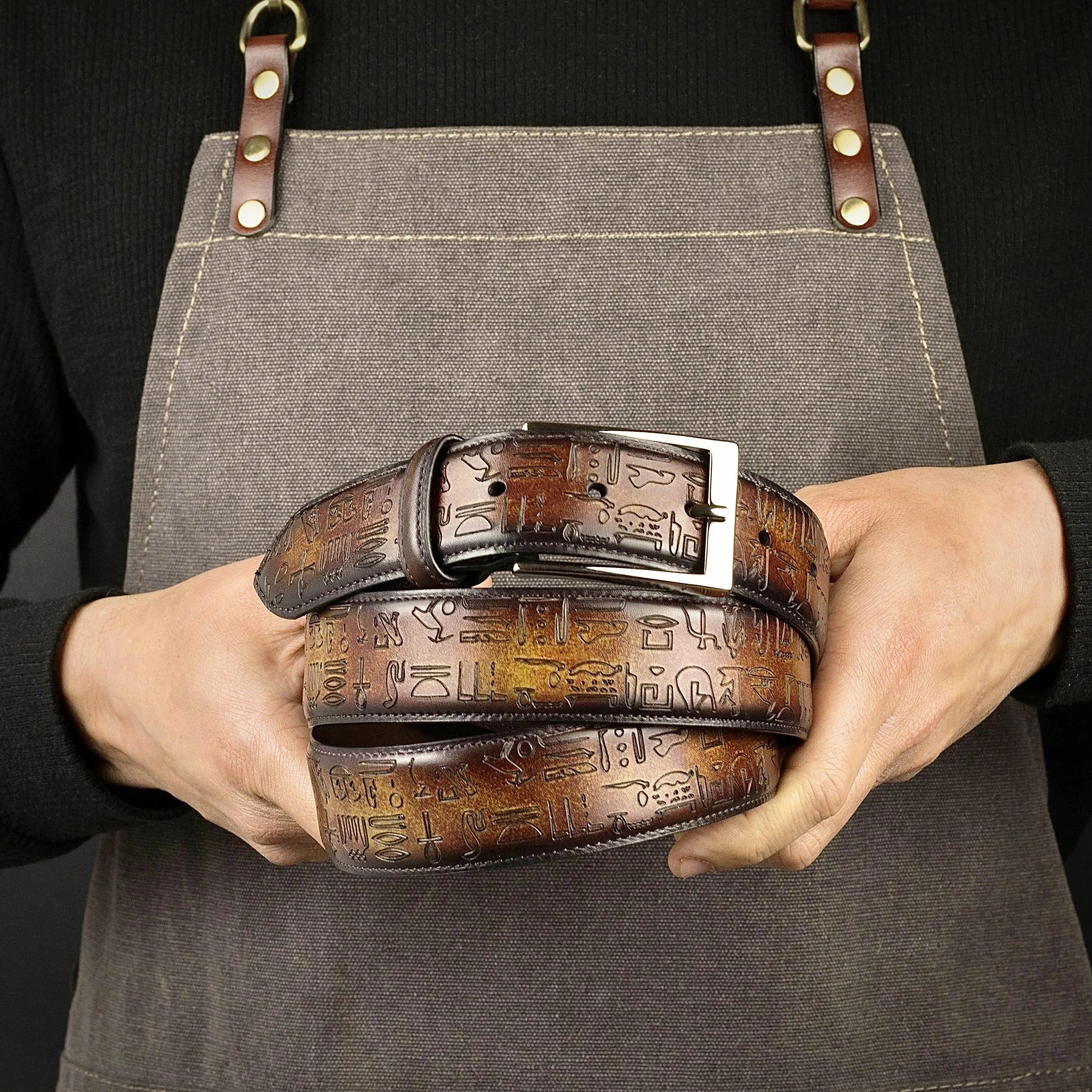 Brown leather Egyptian Patina Belt featuring intricate Egyptian hieroglyphs design