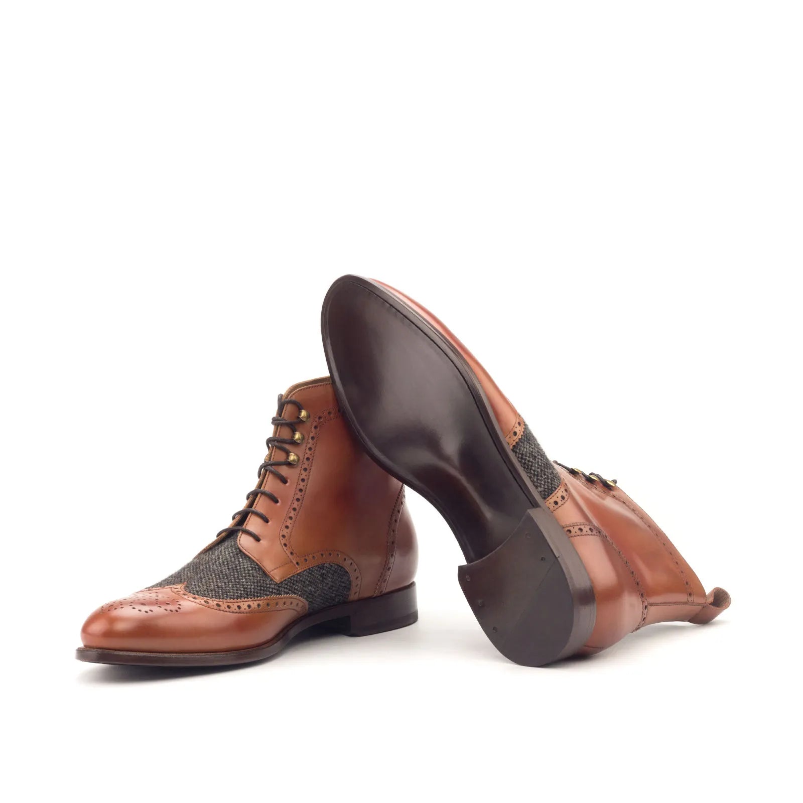 Brown leather wingtip boots, showcasing the stylish Eisen Military Brogue design