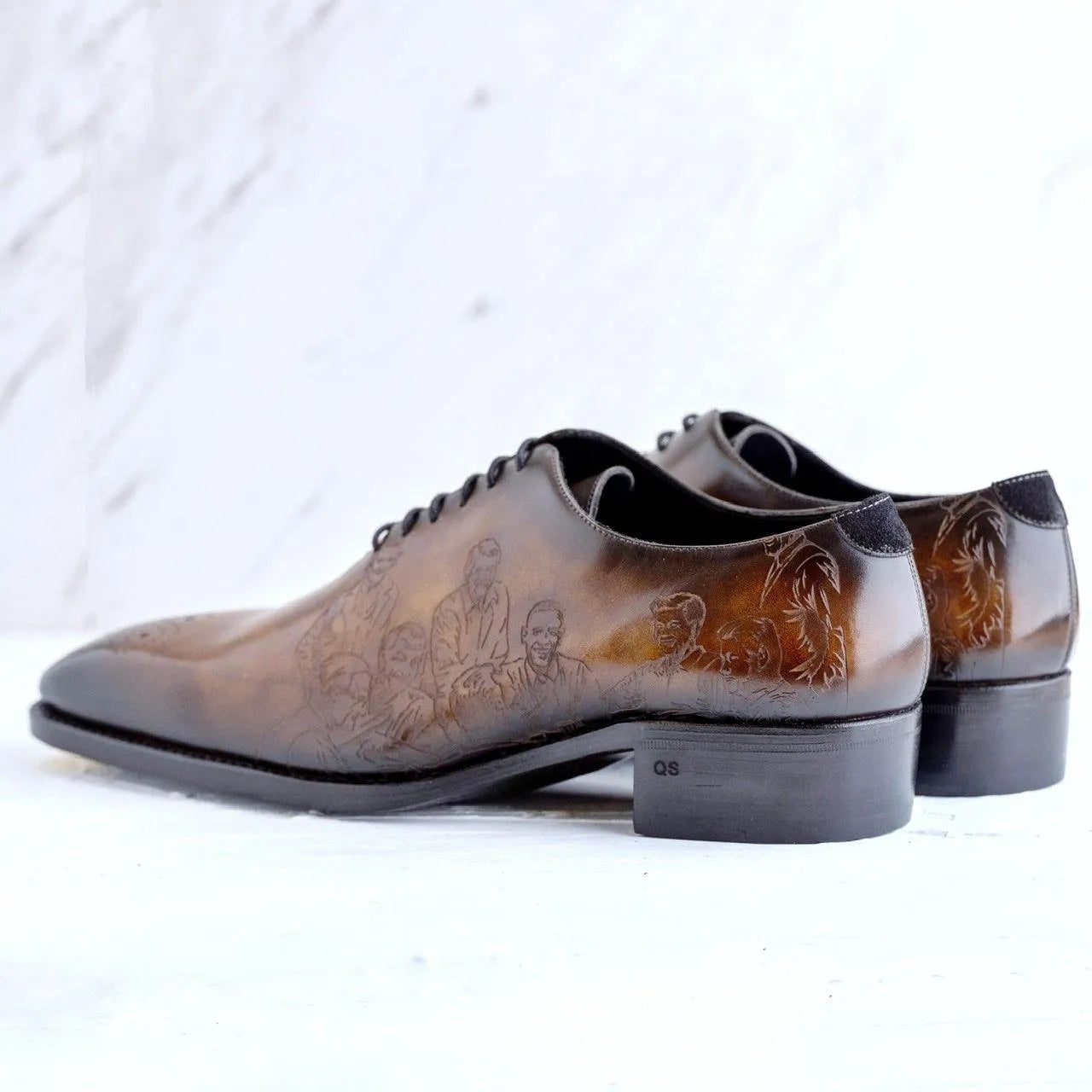 Brown leather dress shoes with etched designs made from Italian Crust Leather