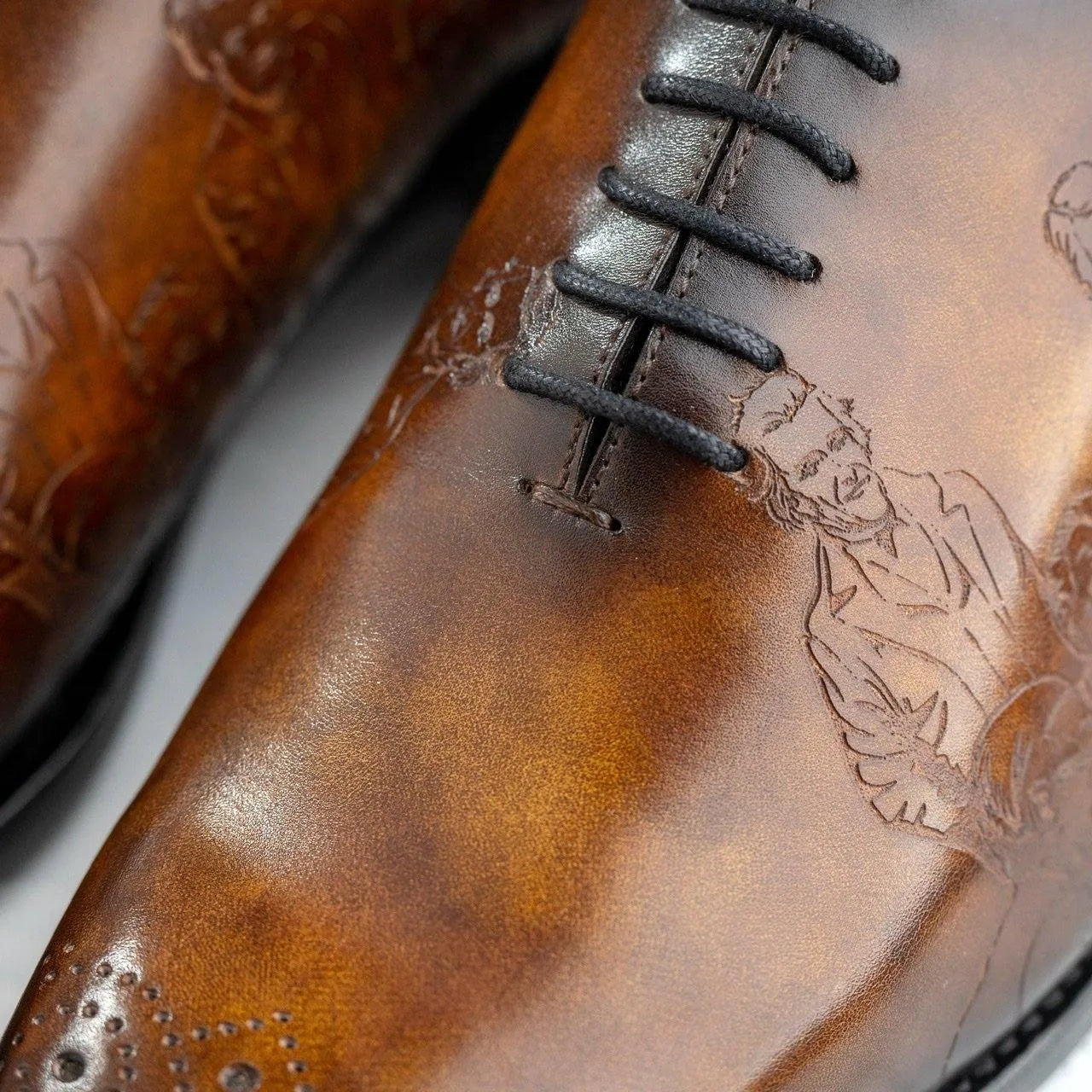 Brown leather dress shoe with black laces, featuring Italian crust leather and Chanel leather sole