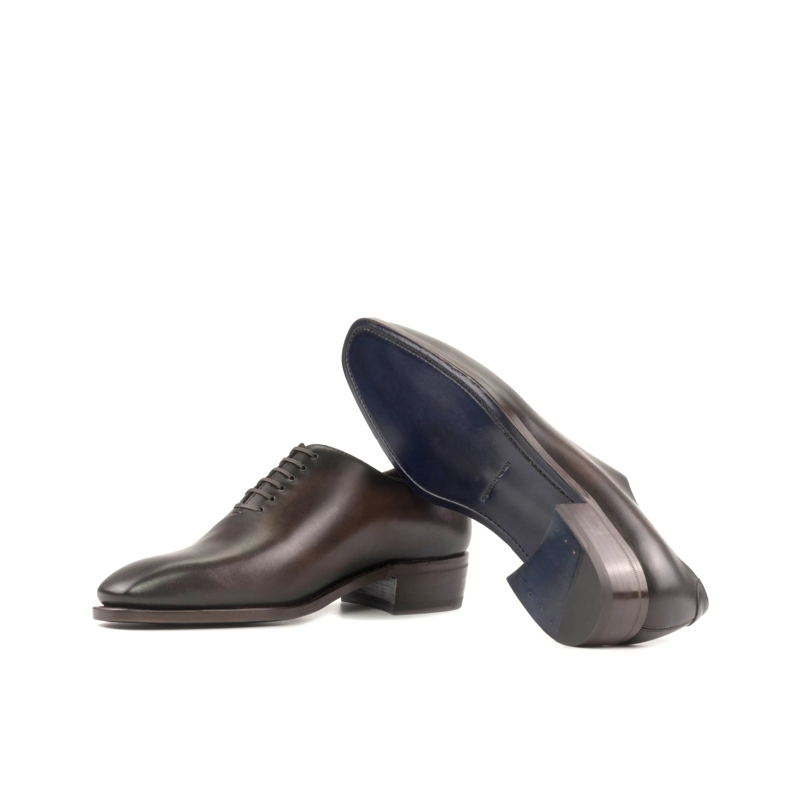 Brown leather Elio Wholecut shoes showcasing elegant craftsmanship and style
