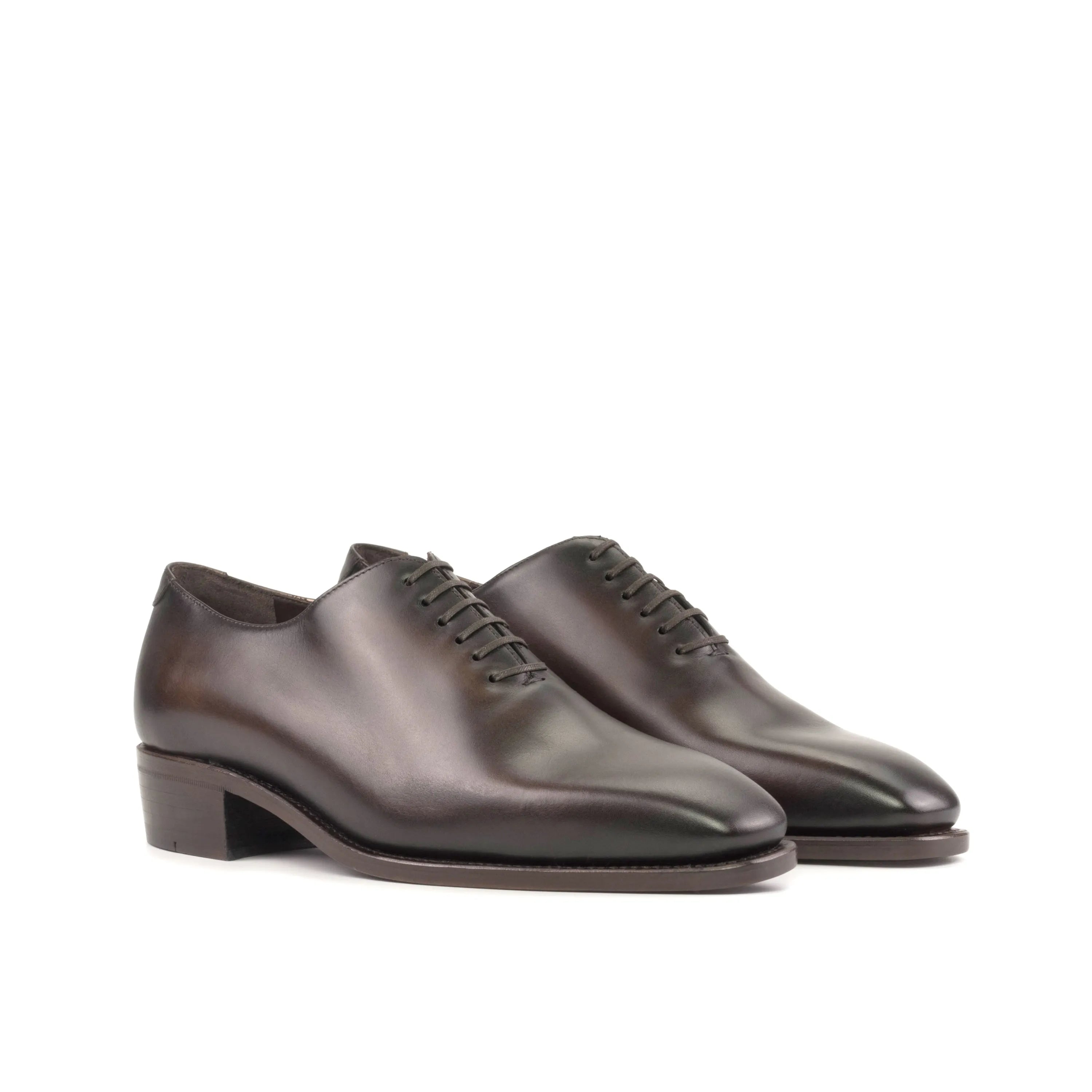 Brown leather Elio Wholecut shoes displayed elegantly for a sophisticated look