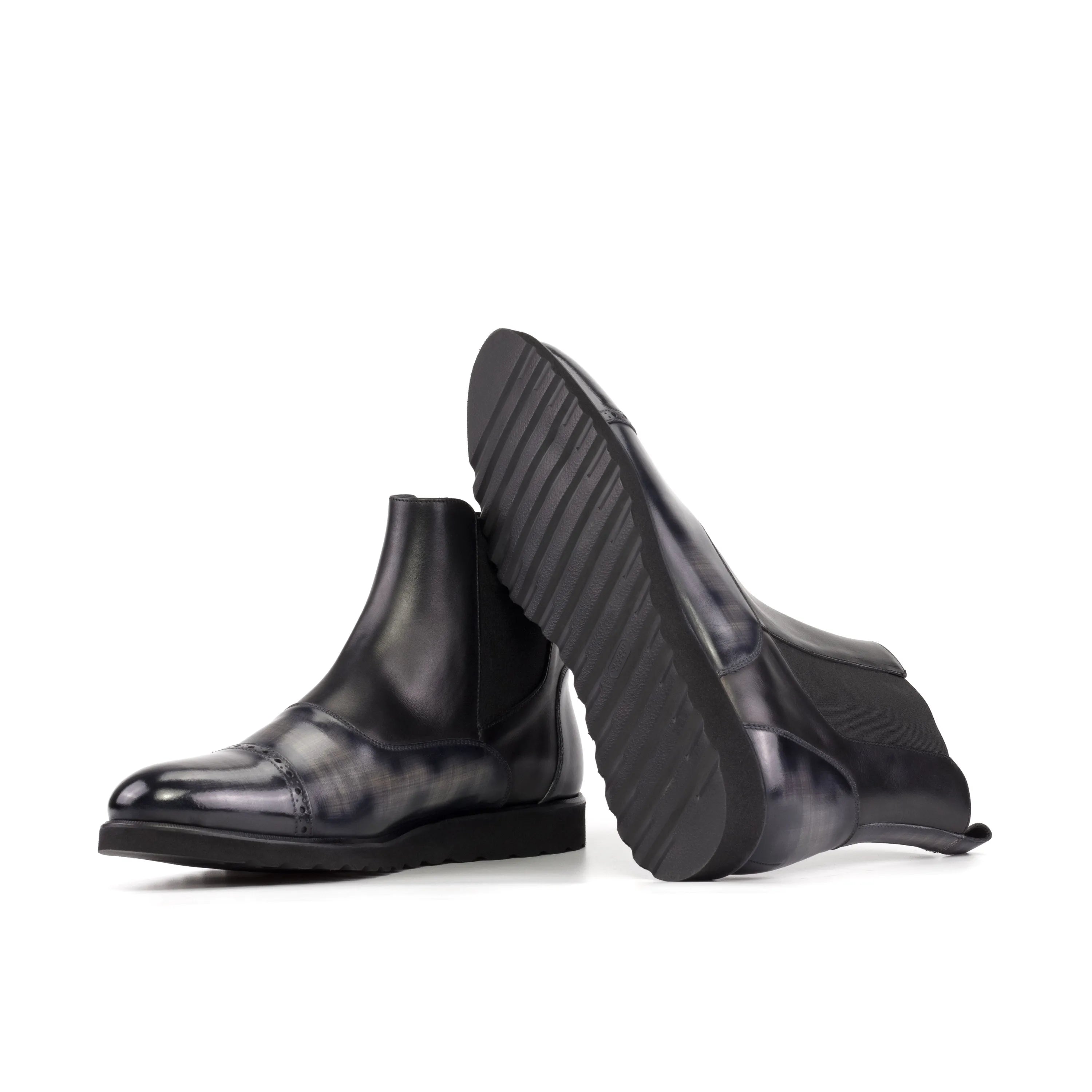 Pair of Elysian Patina Chelsea Boots in black leather for stylish footwear