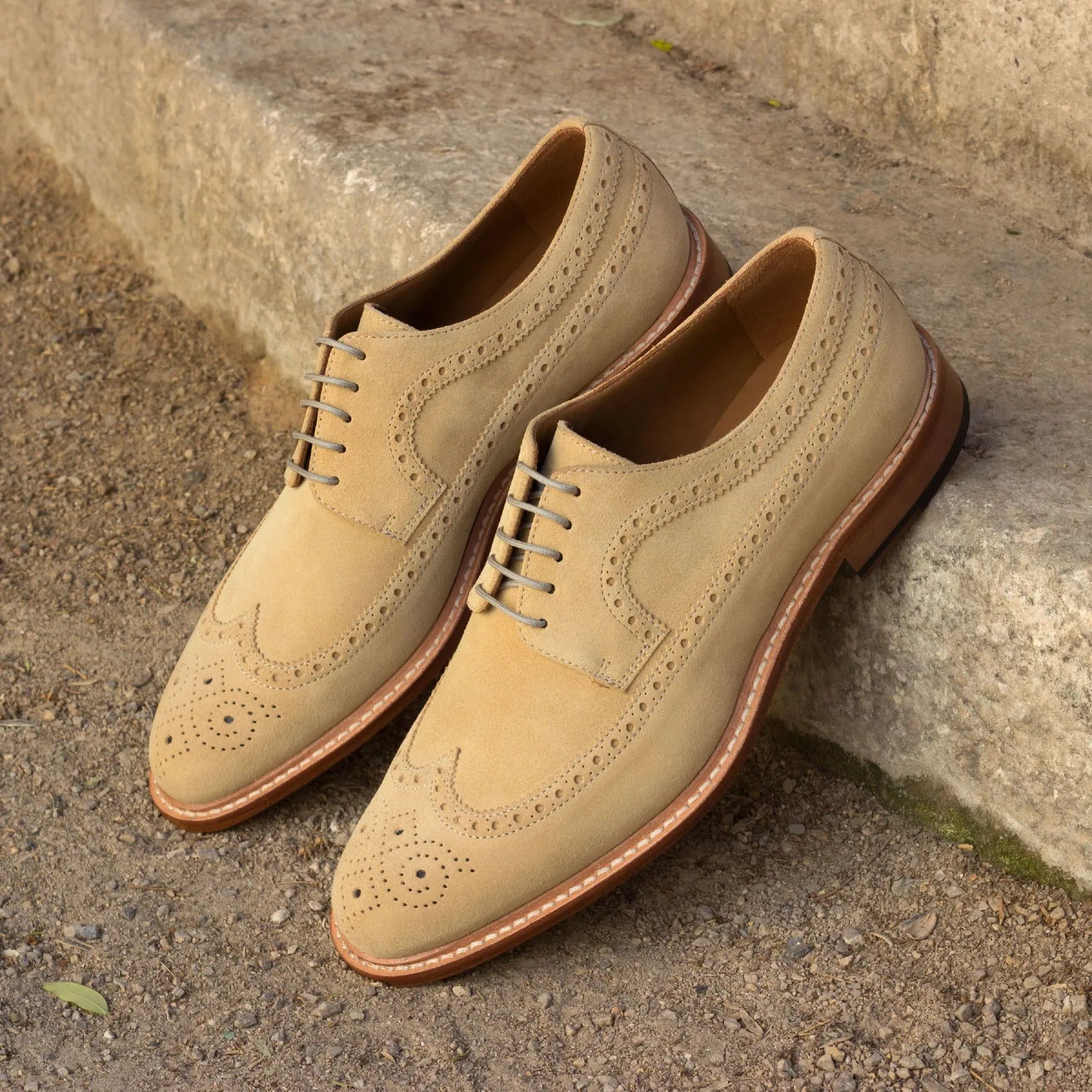 Tan suede Erie Longwing Blucher, featuring classic wingtip design and elegance