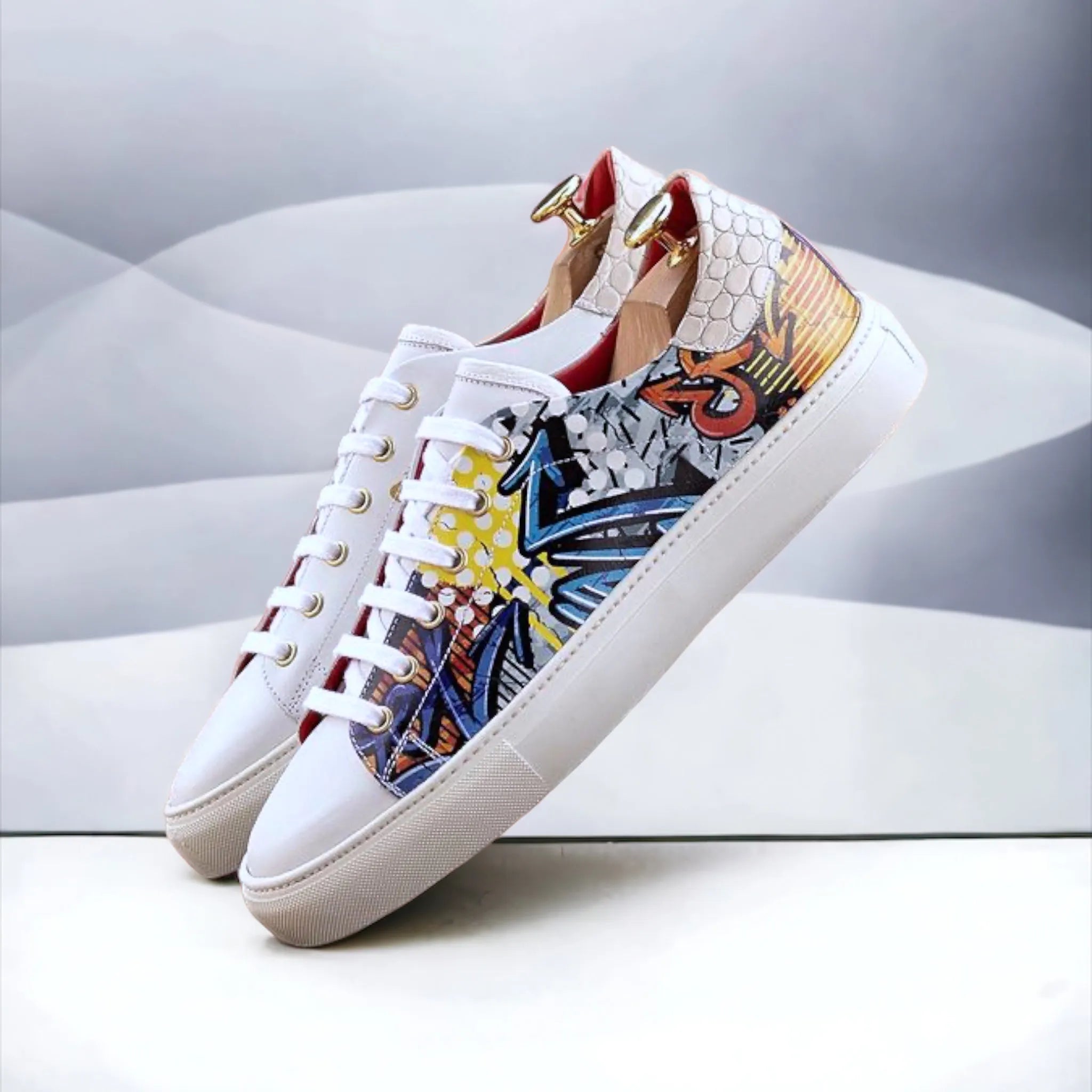 Pair of colorful graffiti design Ezy Trainer Sneaker in white leather
