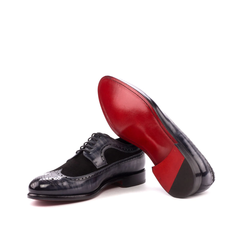 Blue and black leather Faizel Longwing Patina Blucher shoes with red soles displayed