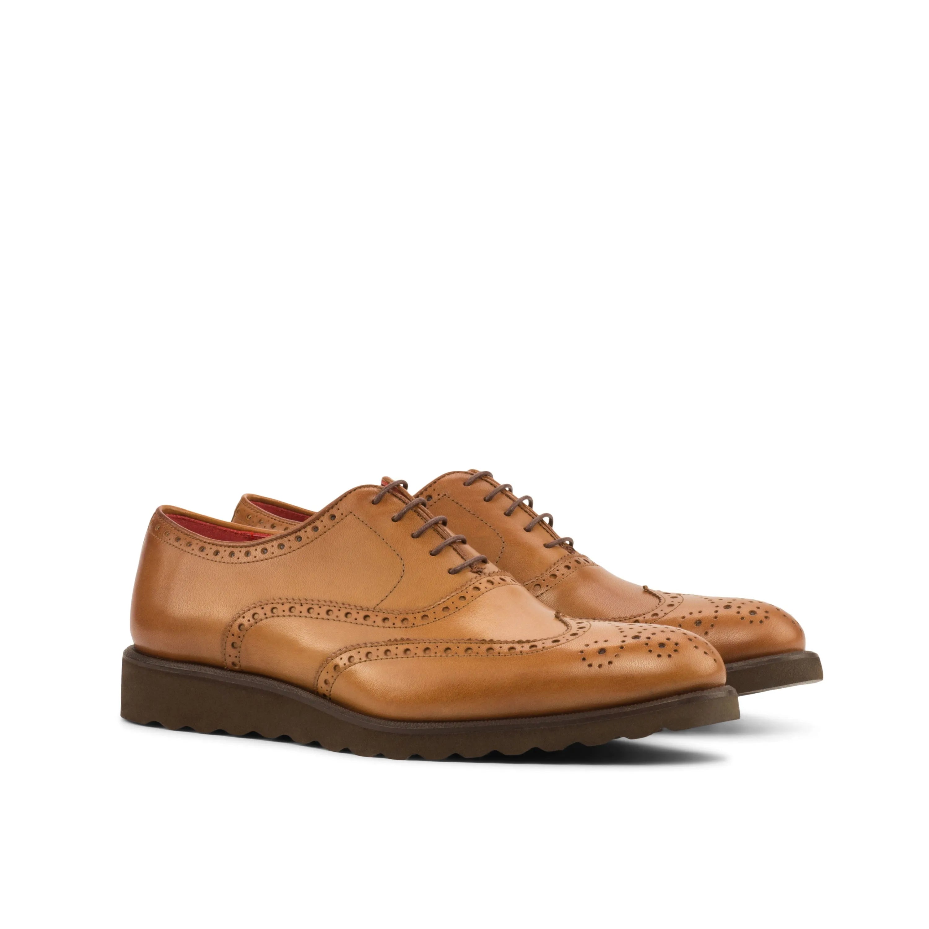Tan leather wingtip brogue shoes, an elegant choice in luxury bespoke shoes for men