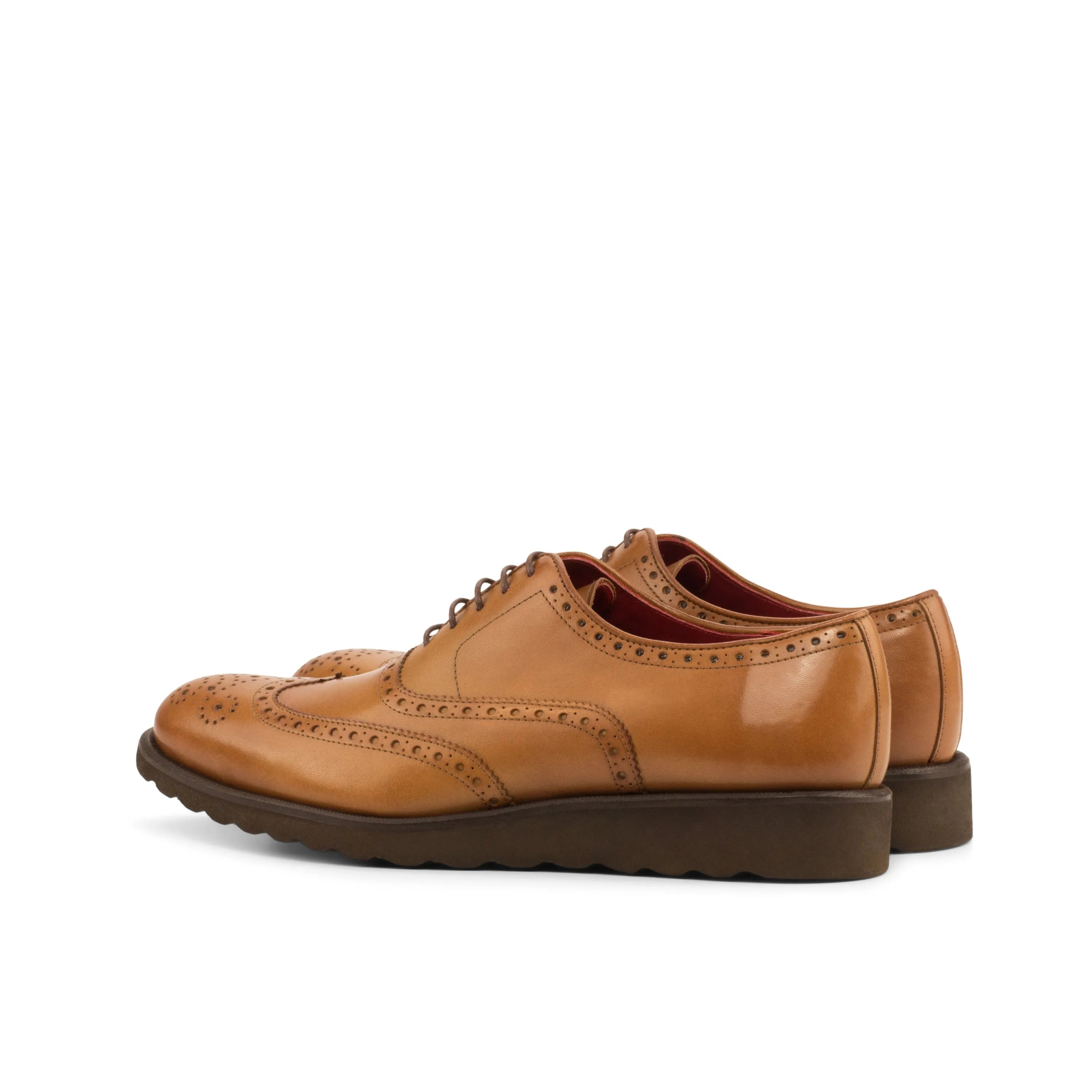 Tan leather wingtip dress shoes.