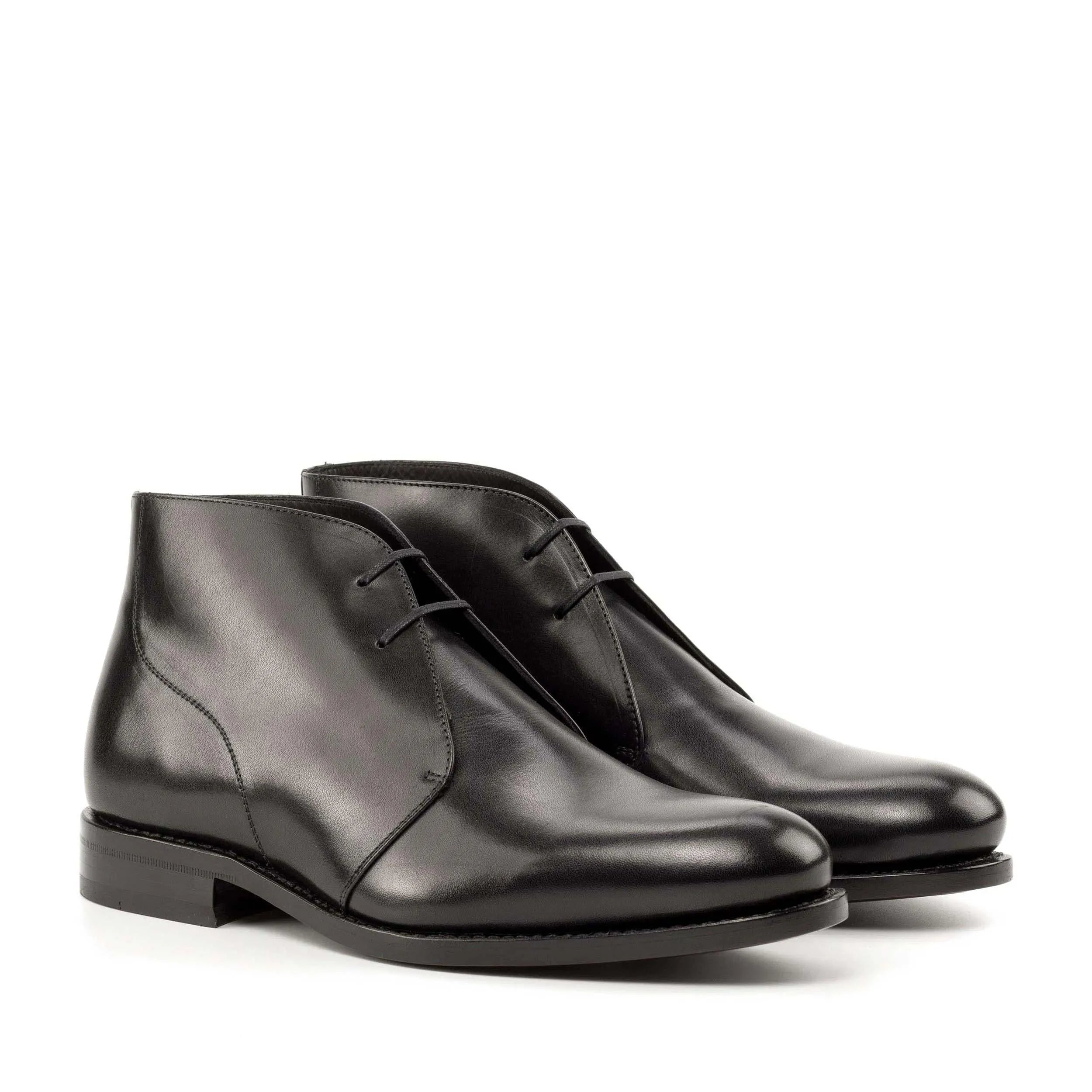 Pair of black leather Filmar Chukka boots showcasing style and versatility for the fast lane