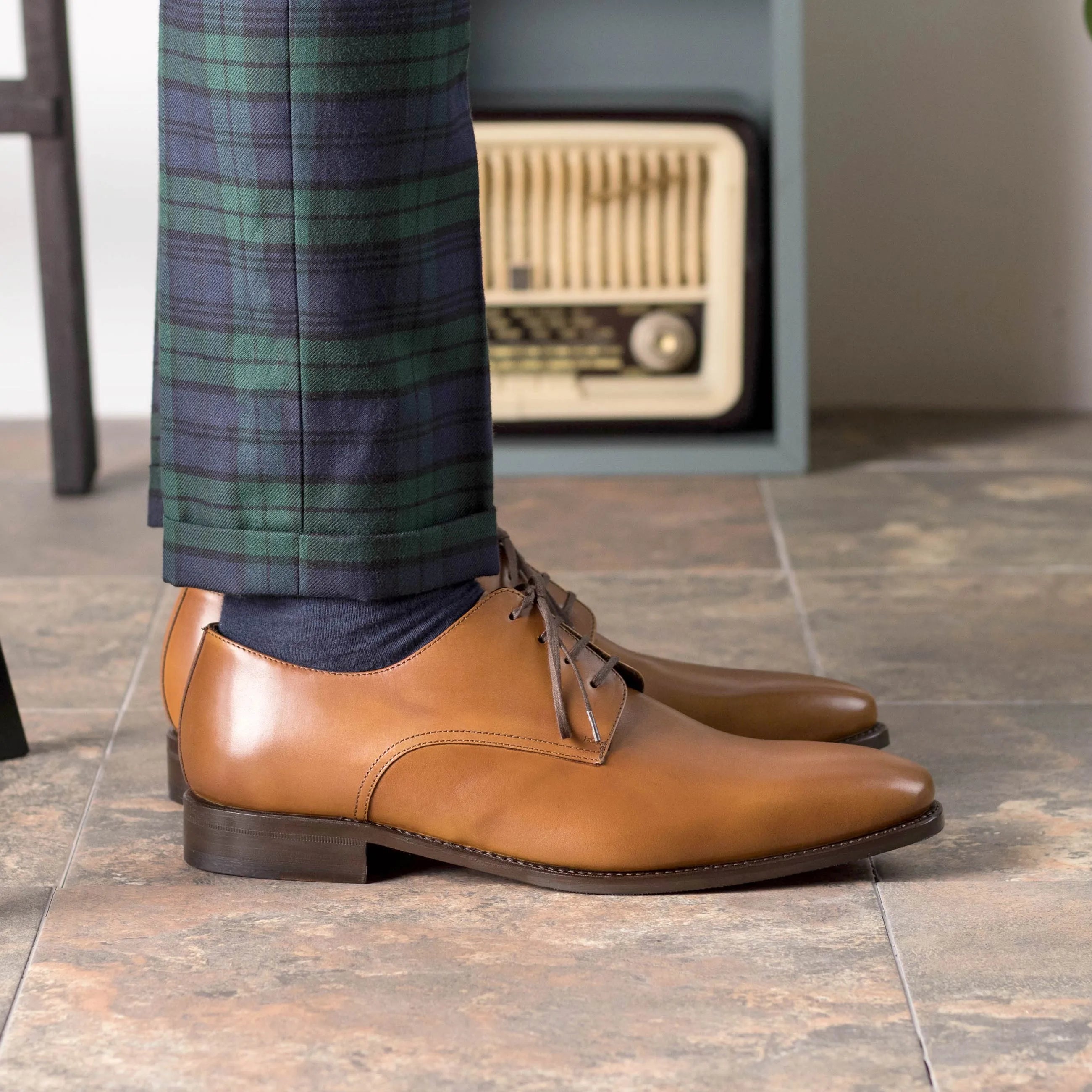 Tan leather Fiolo Derby shoes displayed elegantly for stylish fast lane footwear