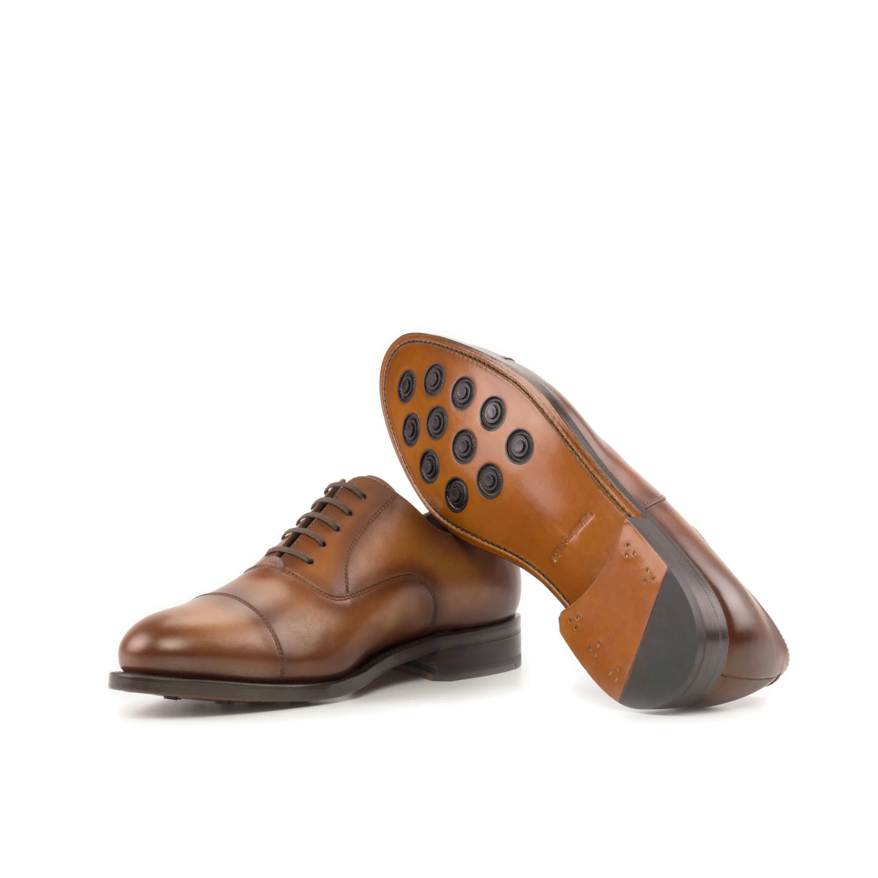 Brown leather dress shoes, showcasing the elegant design of Founder Oxford shoes