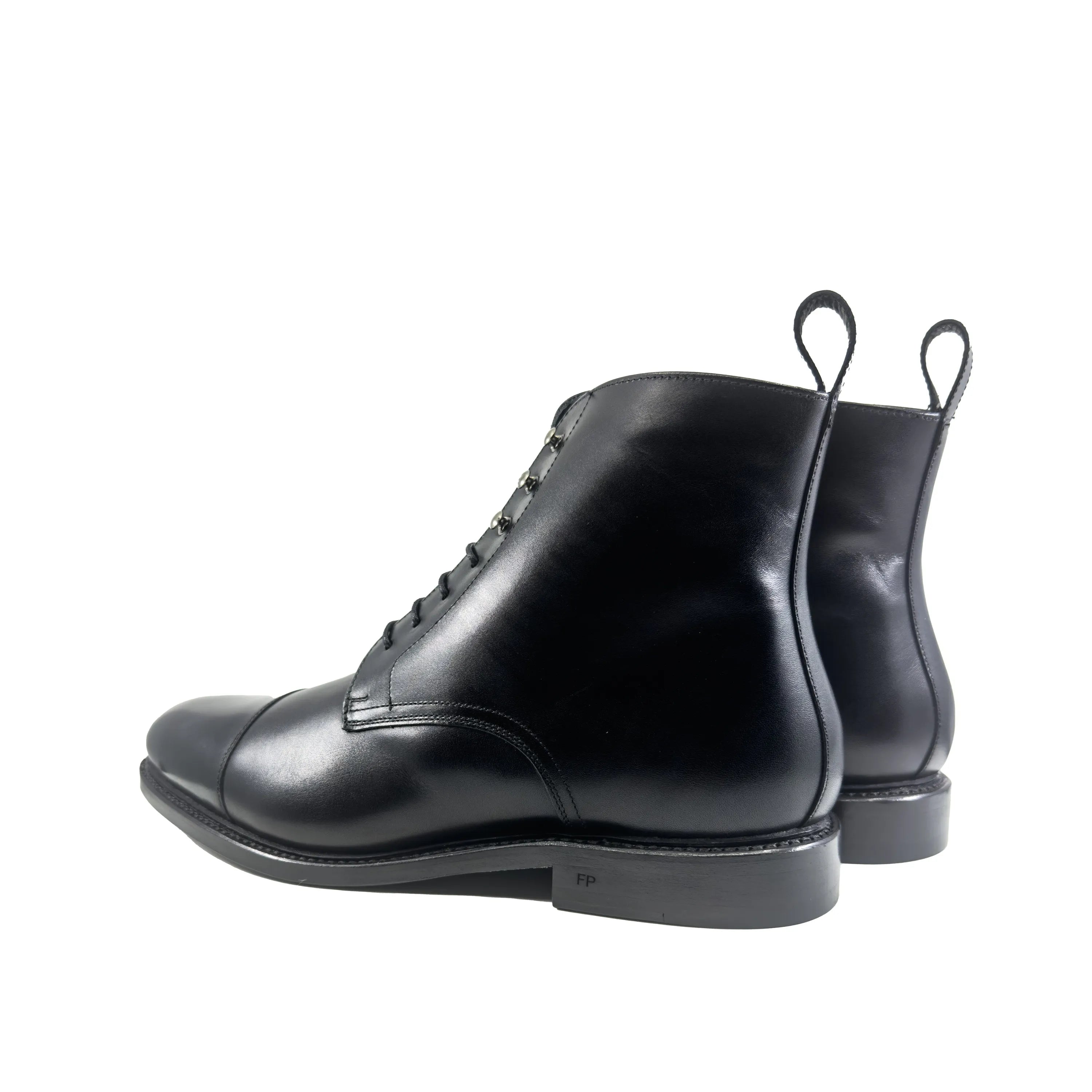 Pair of black leather FP Jumper Boots II for a fast lane look on business days