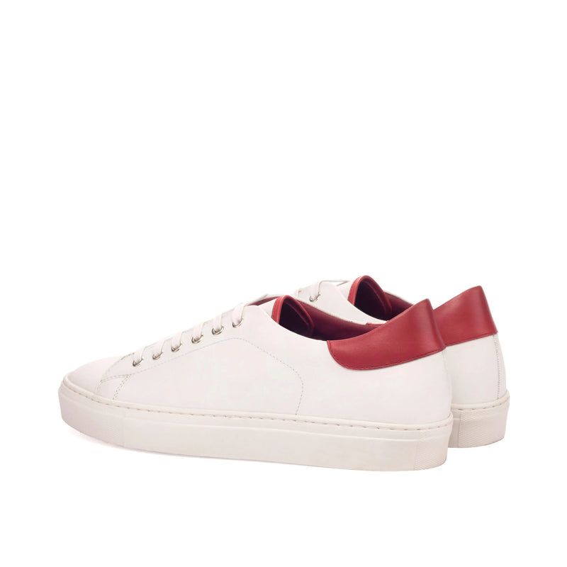 White leather Fridays Trainer Sneakers featuring a stylish red heel detail