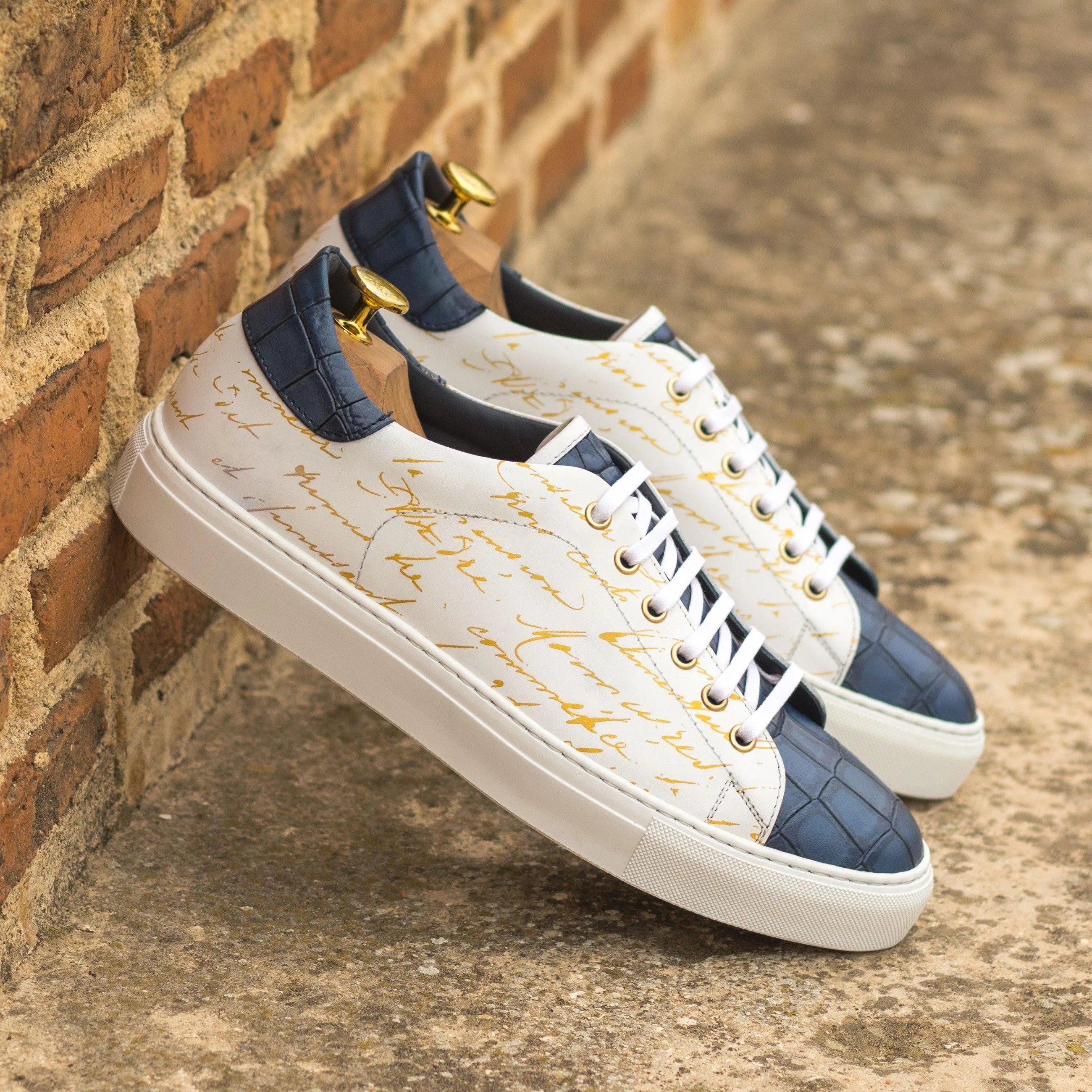 Stylish white and blue Frost Trainer Sneaker featuring a modern cupsole trainer design