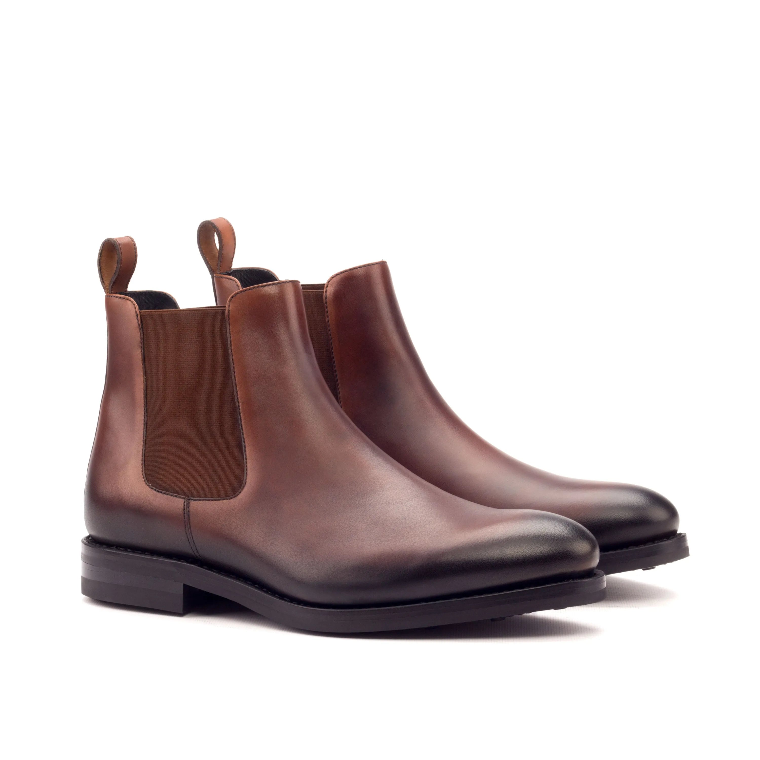 Pair of brown leather Gall Chelsea Boots elegantly designed for style and comfort