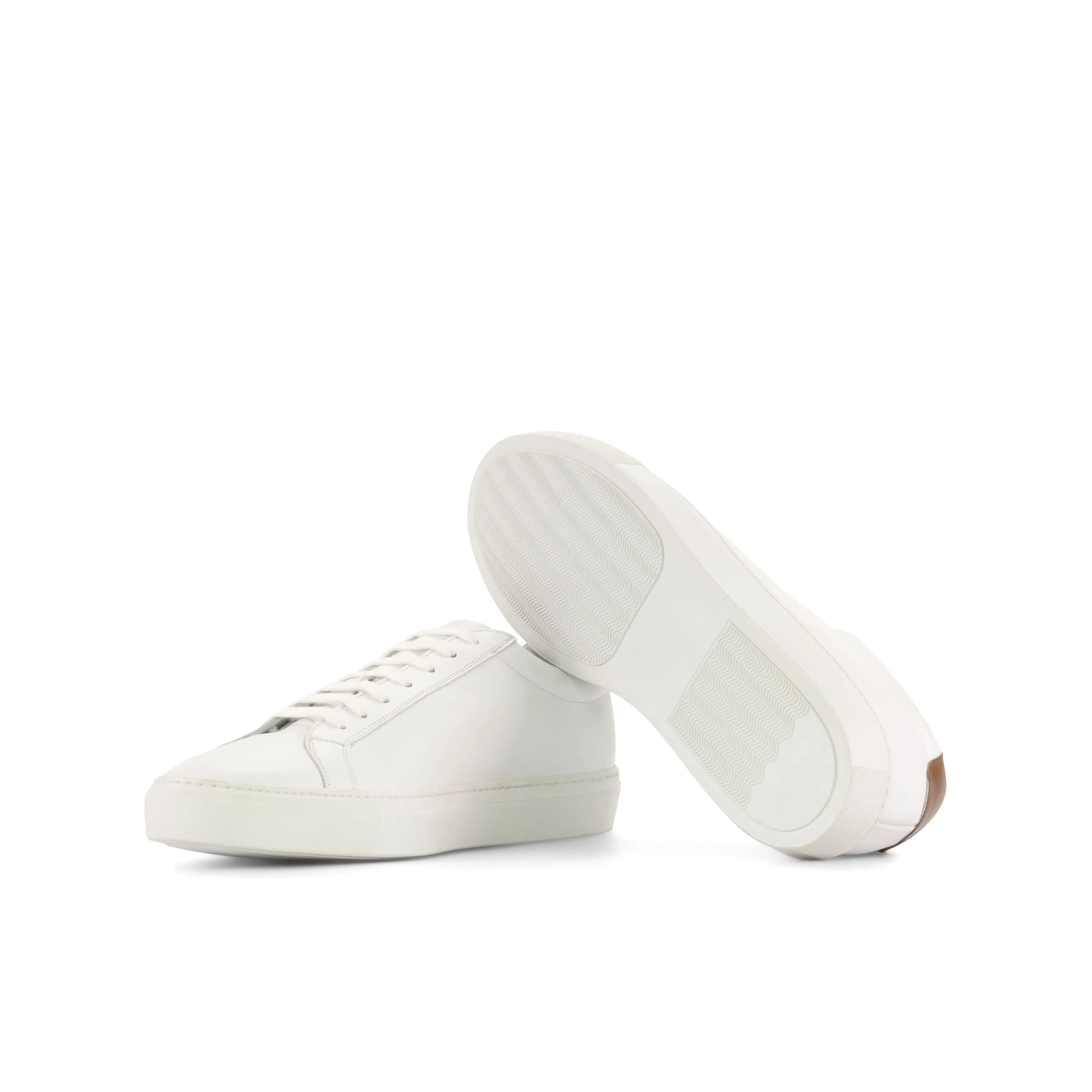 Pair of white leather Garry Low Kick Sneakers for a stylish and comfortable look
