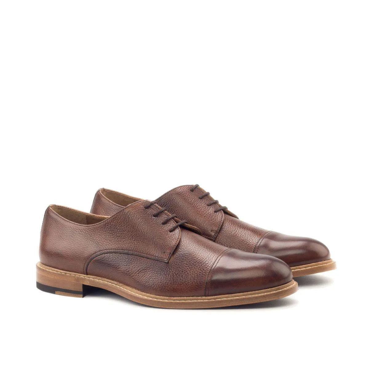Brown leather Gavins Derby shoes featuring a classic patina finish and derby split toe design