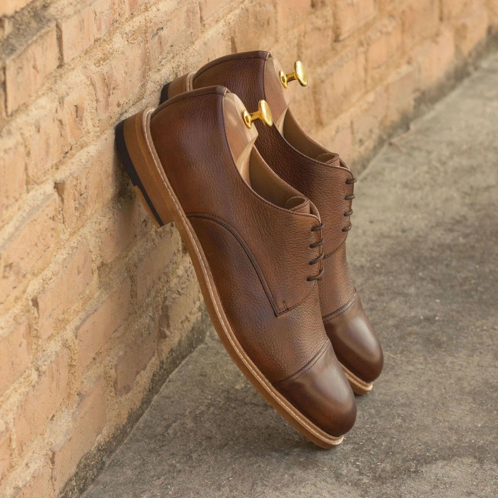 Pair of brown leather Gavins Derby shoes showcasing a classic patina finish
