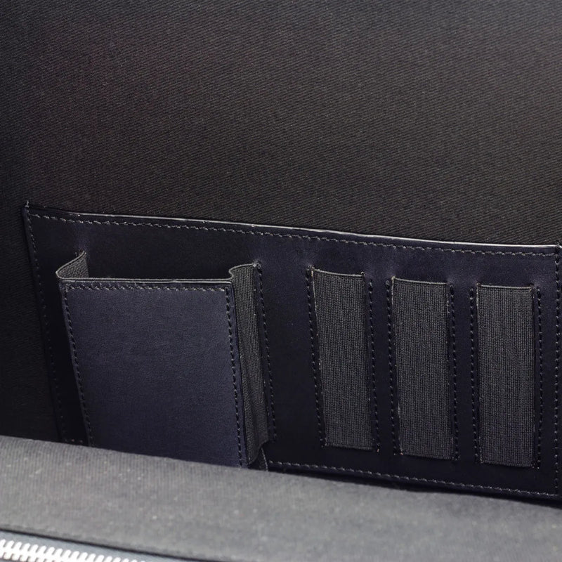 Dark blue organizer panel of a Gentleman Briefcase showcasing unique savoir-faire