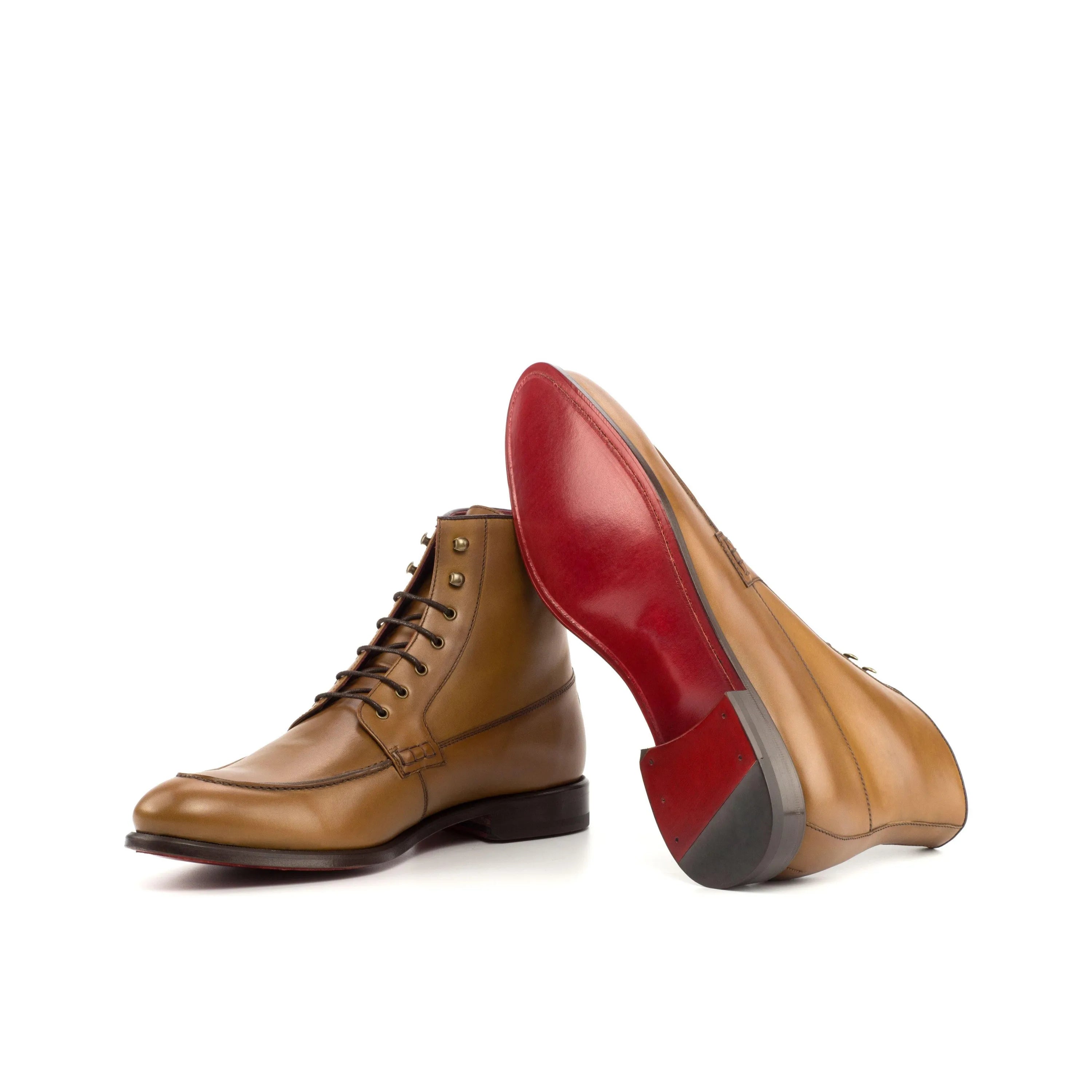 Tan leather Georgino Moc Boot with red soles, perfect for stylish footwear choices