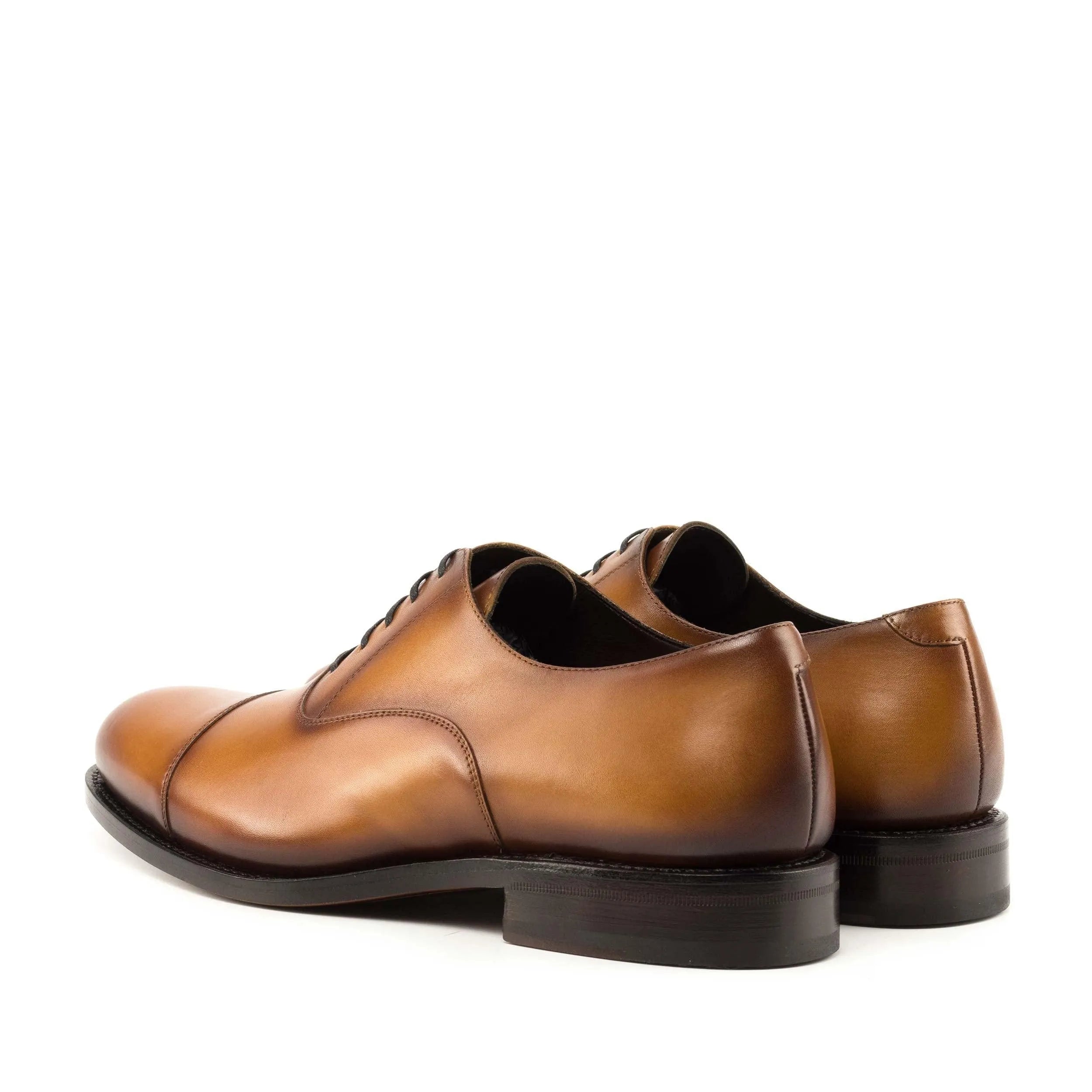 Pair of brown leather Georgy Oxford shoes II showcasing classic style and elegance