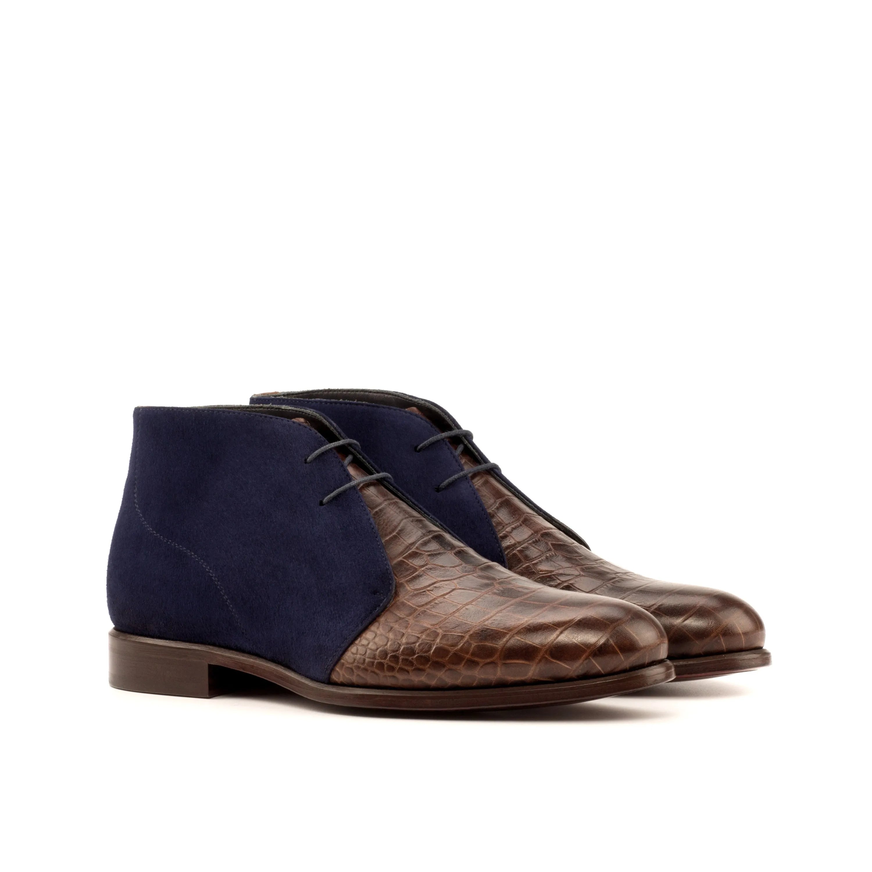 Two-tone leather and suede Geovano Chukka boots displayed for stylish footwear options