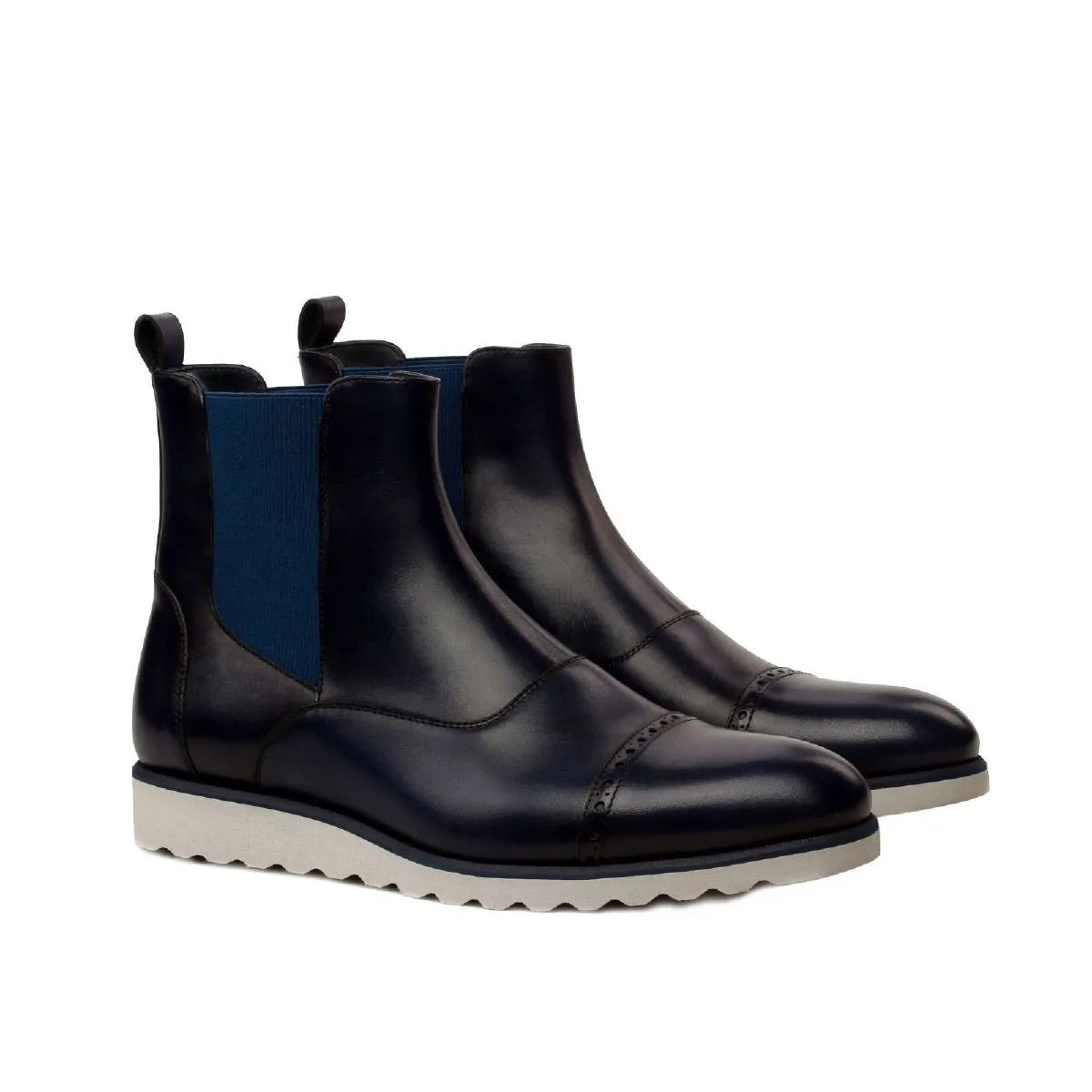 Pair of navy leather Hardwin Chelsea Boots showcasing stylish and versatile design