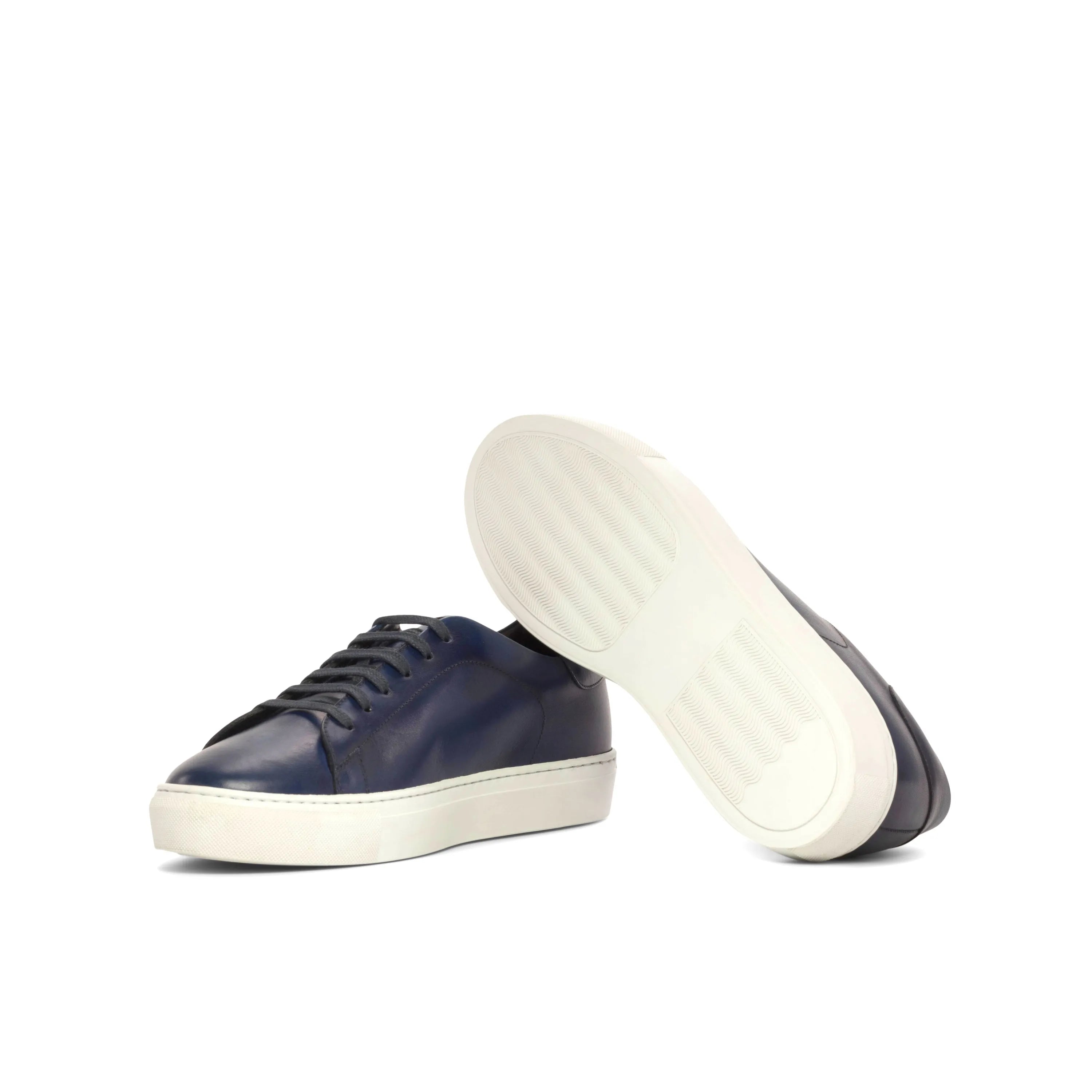 Pair of navy leather sneakers, featured in Jacksons Trainer Sneaker, perfect for fast lane trends