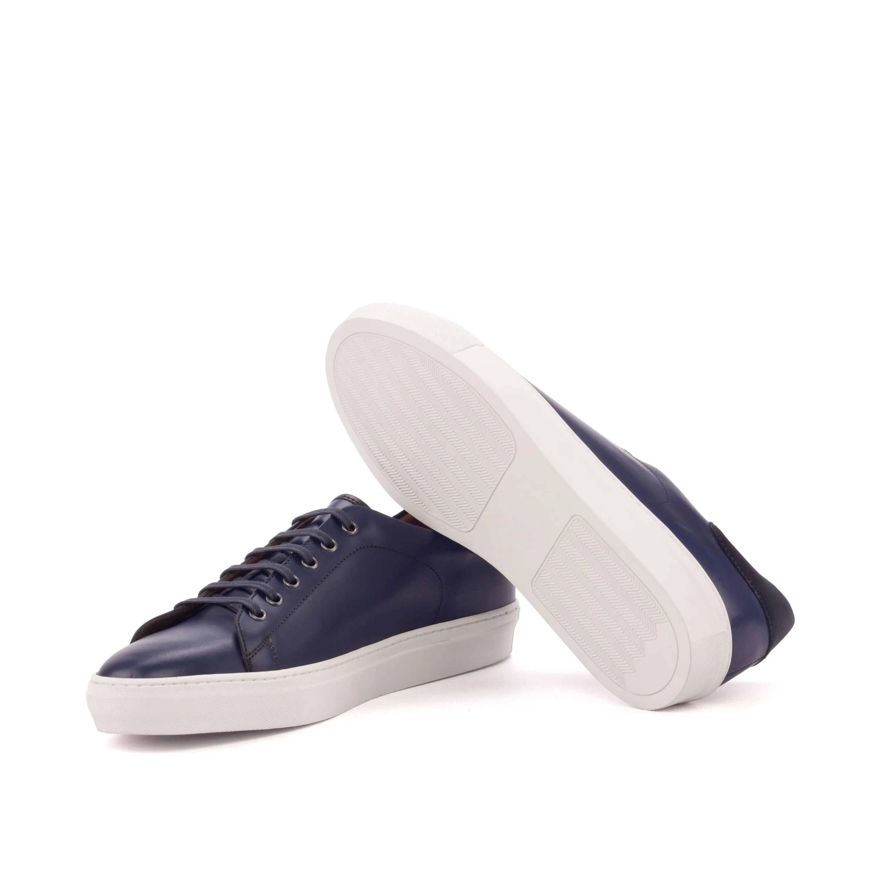 Pair of navy leather Jad Trainer Sneakers showcasing stylish comfort and modern design