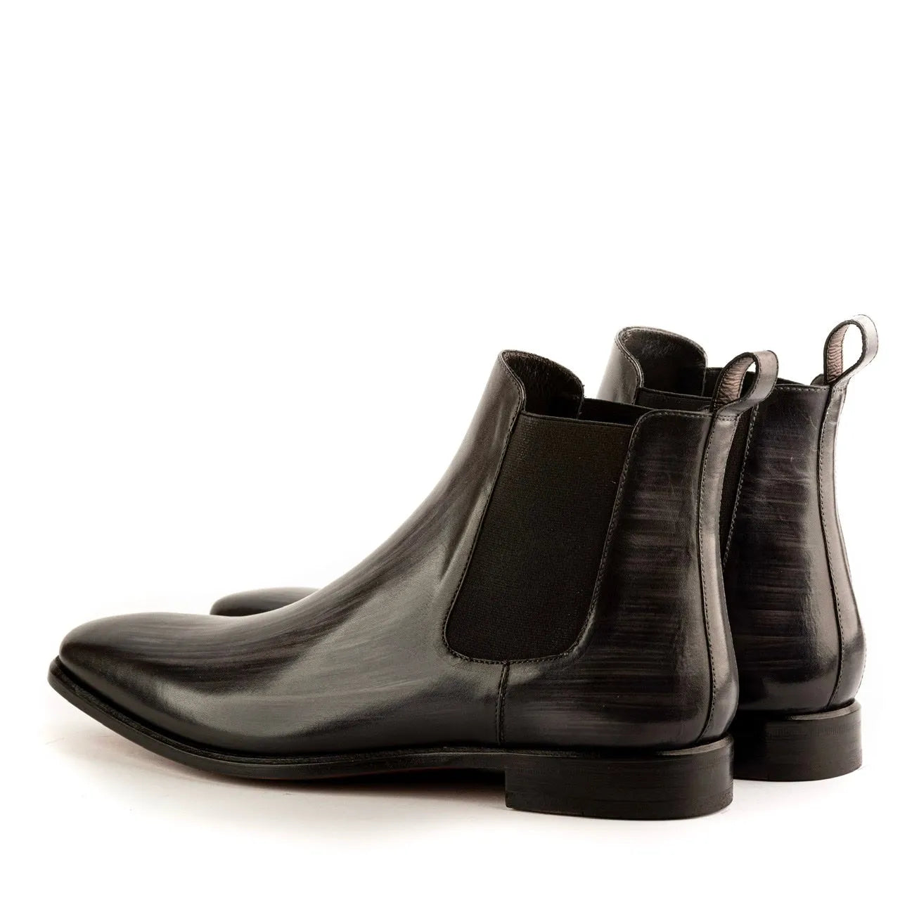 Pair of black leather JT Chelsea Patina Boots II showcasing elegant chelsea patina design