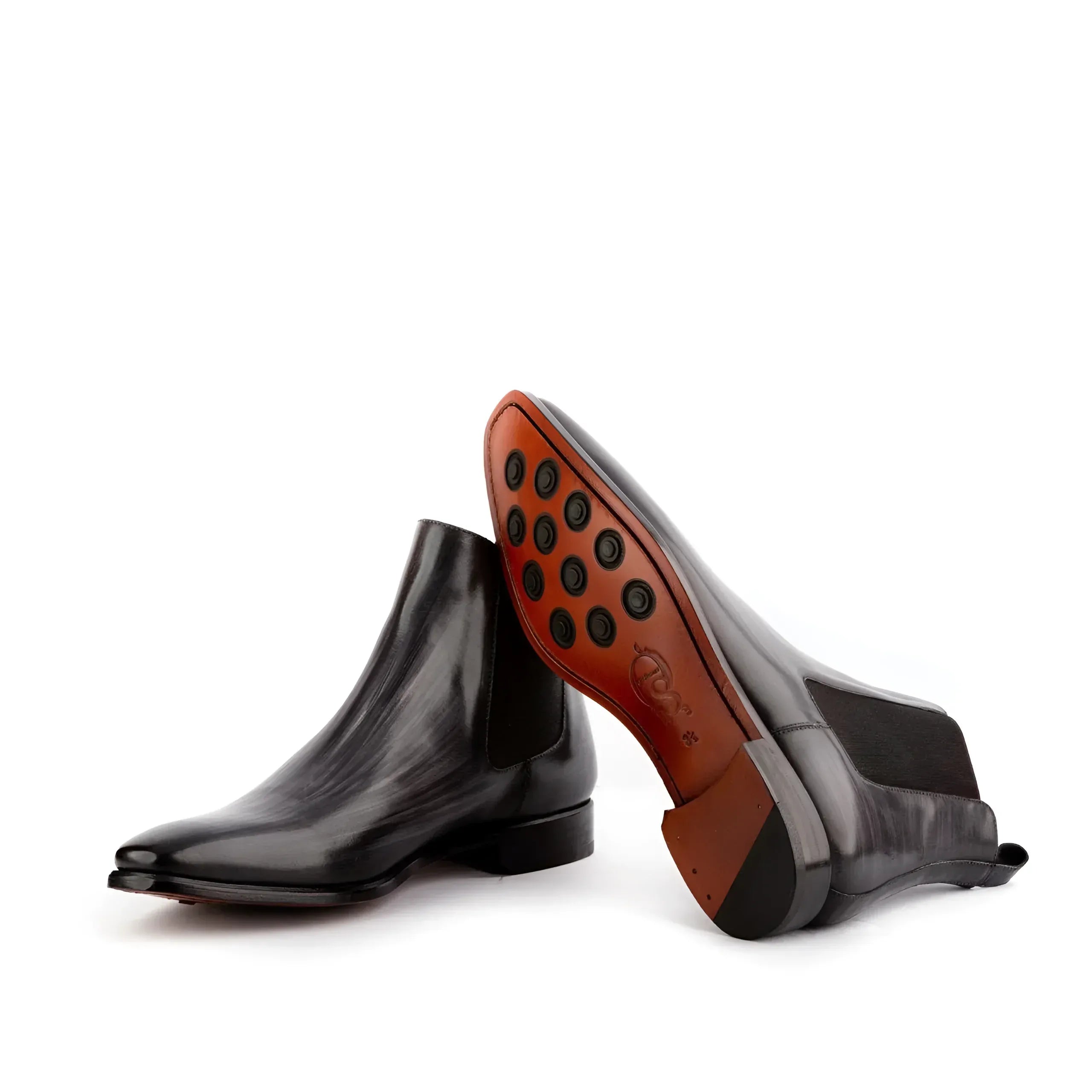 Pair of gray leather Chelsea Patina Boots featuring elegant design and stylish durability