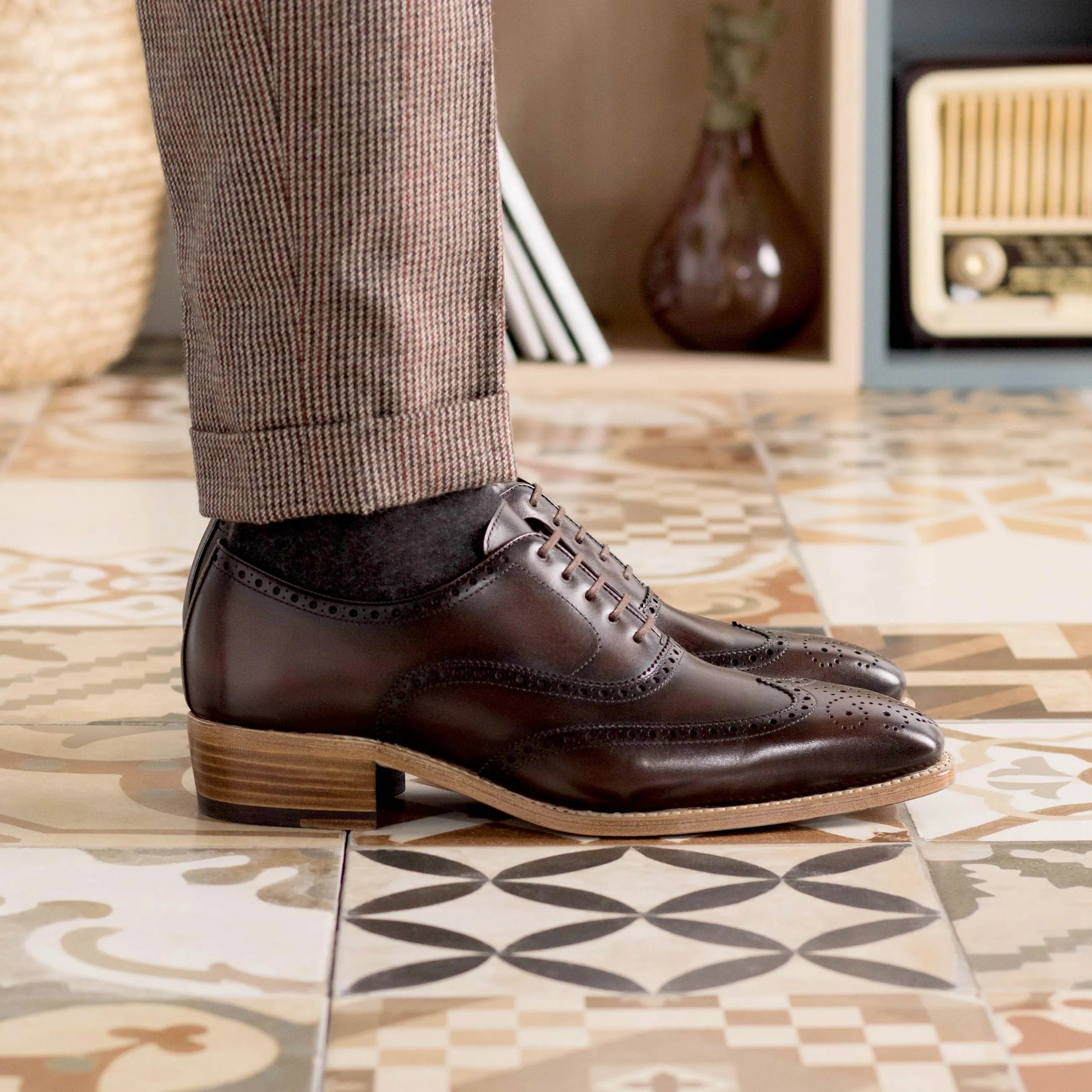 Brown leather wingtip brogue shoes for a sophisticated dress shoe collection
