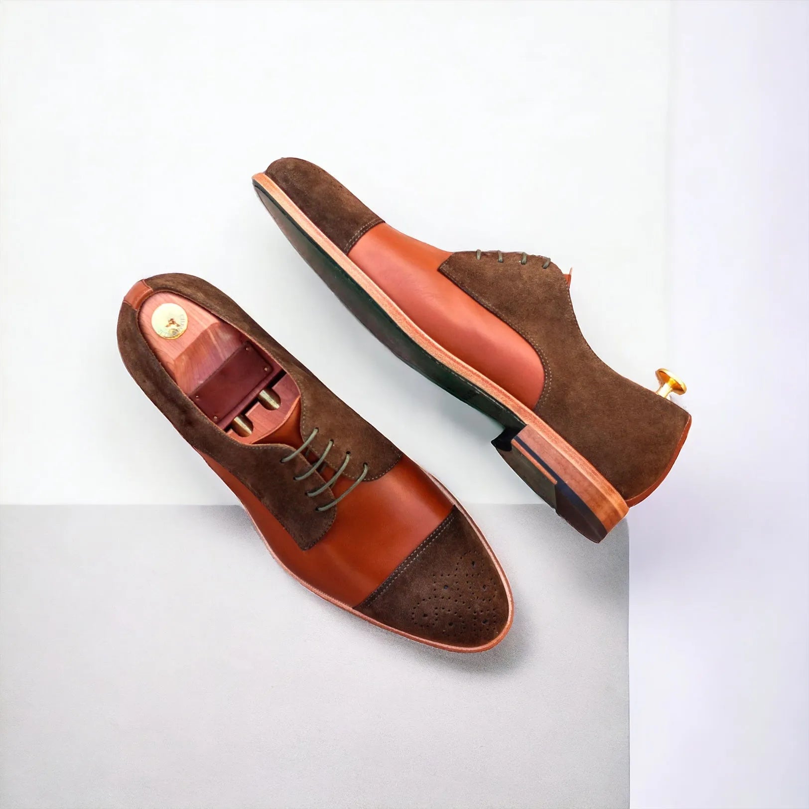Two-toned brown leather Junos Derby shoes on a stylish display