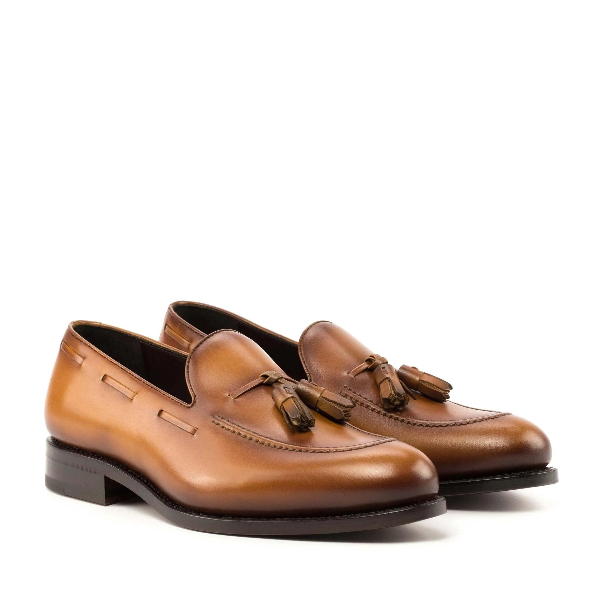 Pair of brown leather tassel loafers, ideal for the Leon Loafers collection, fast lane style