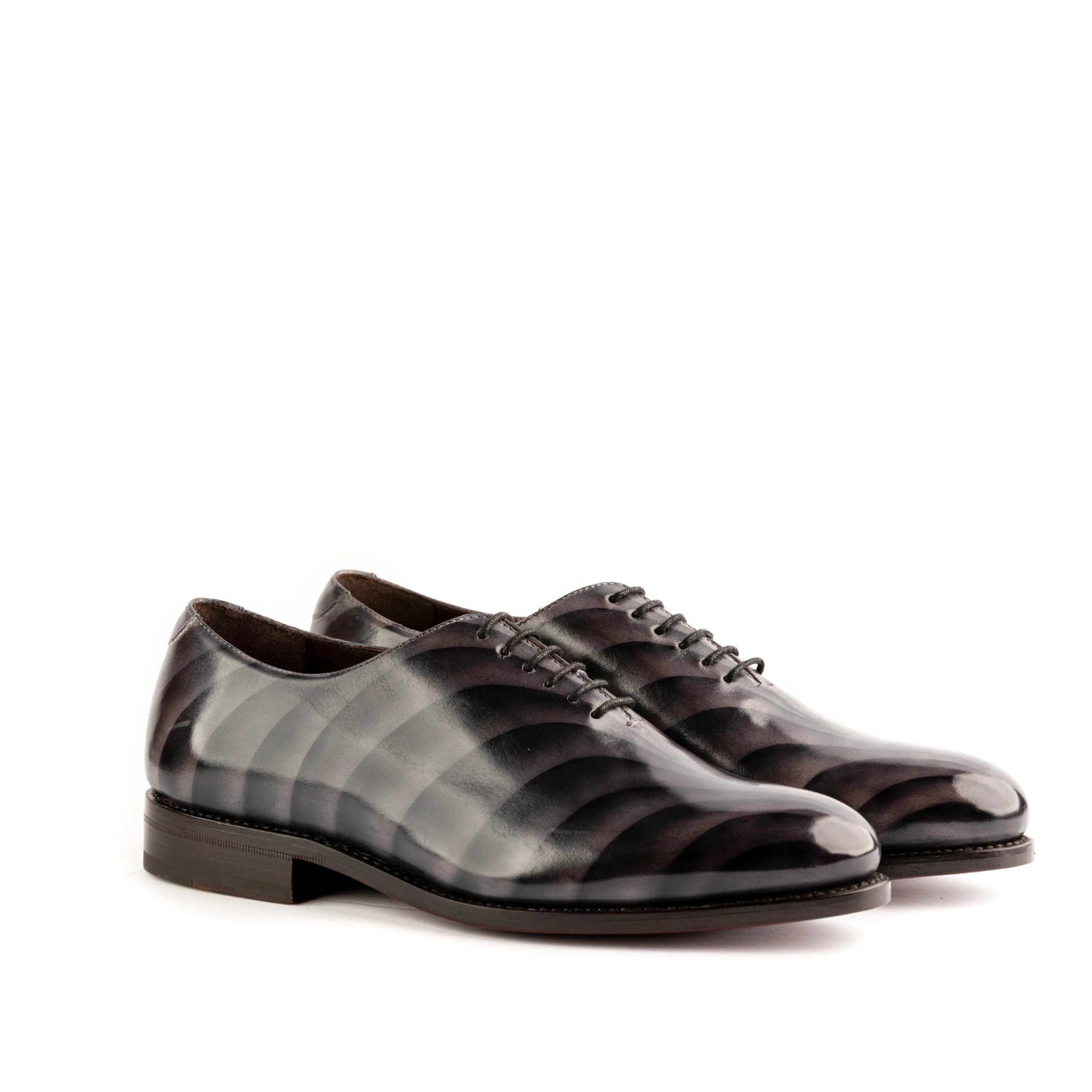 Pair of striped black leather dress shoes from Leonidas Patina Wholecut II collection