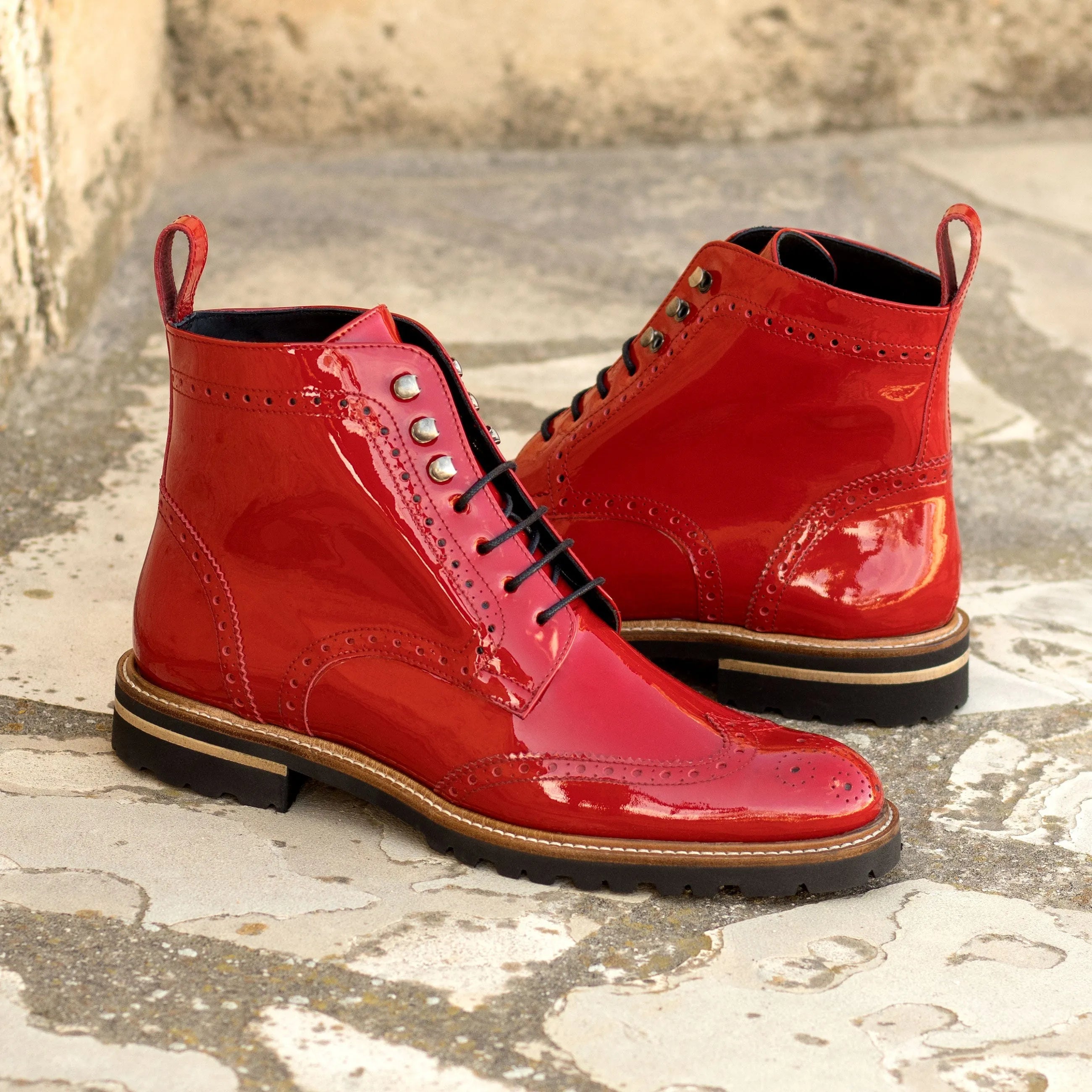 Shiny red leather Lila Unisex Military Brogue Boots displaying a stylish design