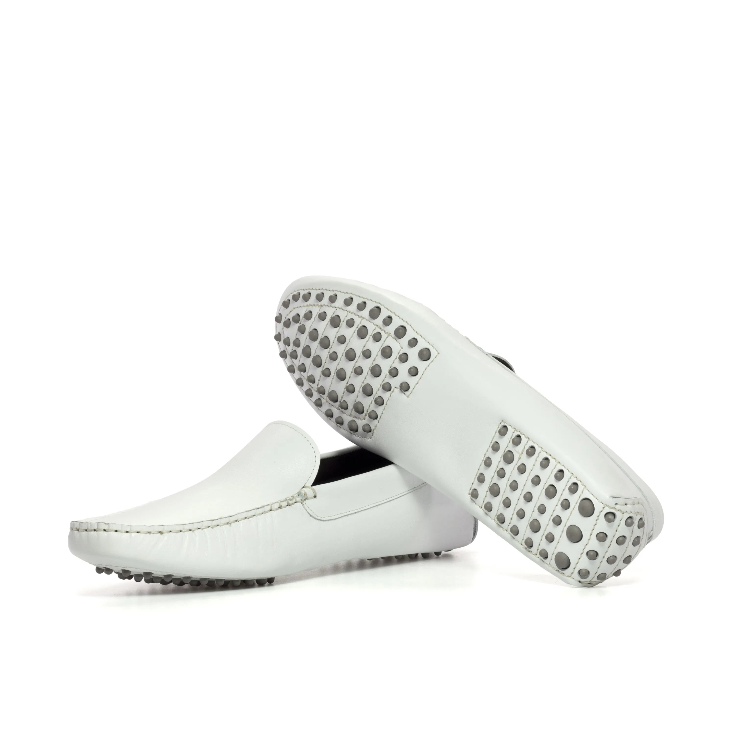 White leather driving shoes from Lincoln, ideal for a stylish driver or casual cart rides