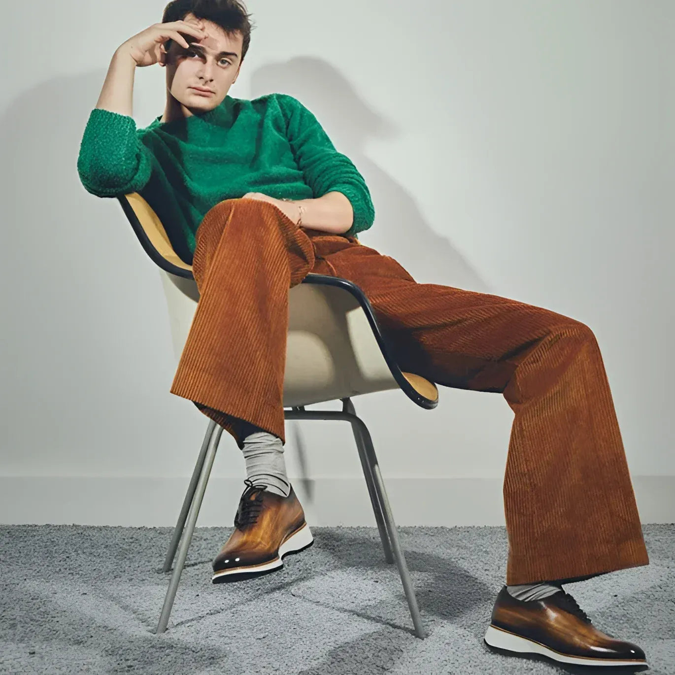 Man in green sweater and brown corduroy pants wearing Lloyd Wholecut Patina shoes II