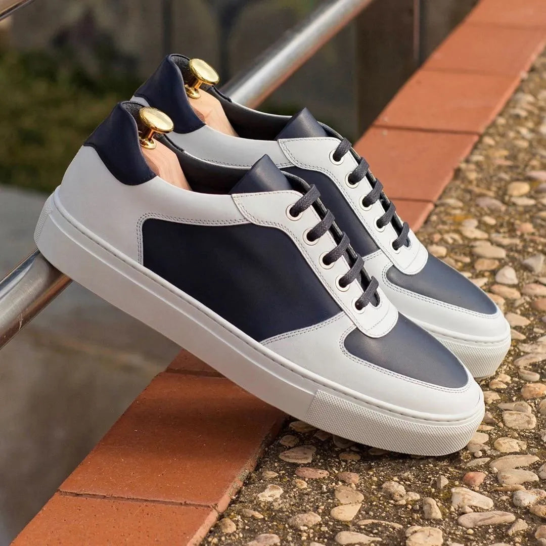 Two-tone leather sneakers featuring the Lonis Low Top Sneaker design for luxury style