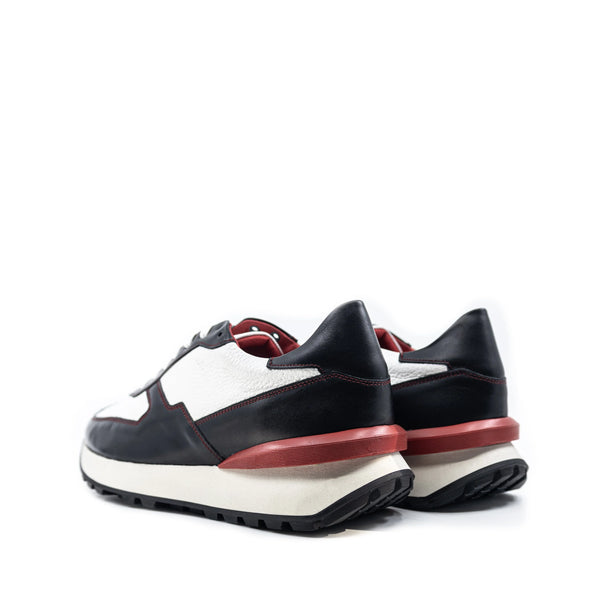 M10 Chunky Tempo Trainer Sneaker in black and white Italian leather with red accents and exaggerated proportions