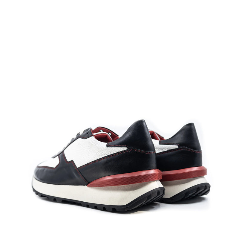 M10 Chunky Tempo Trainer Sneaker in black and white Italian leather with red accents and exaggerated proportions
