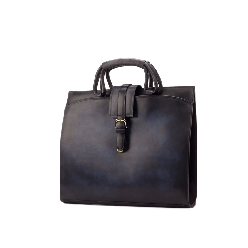 Black leather Machino briefcase with buckle showcasing unique savoir-faire and painted calf