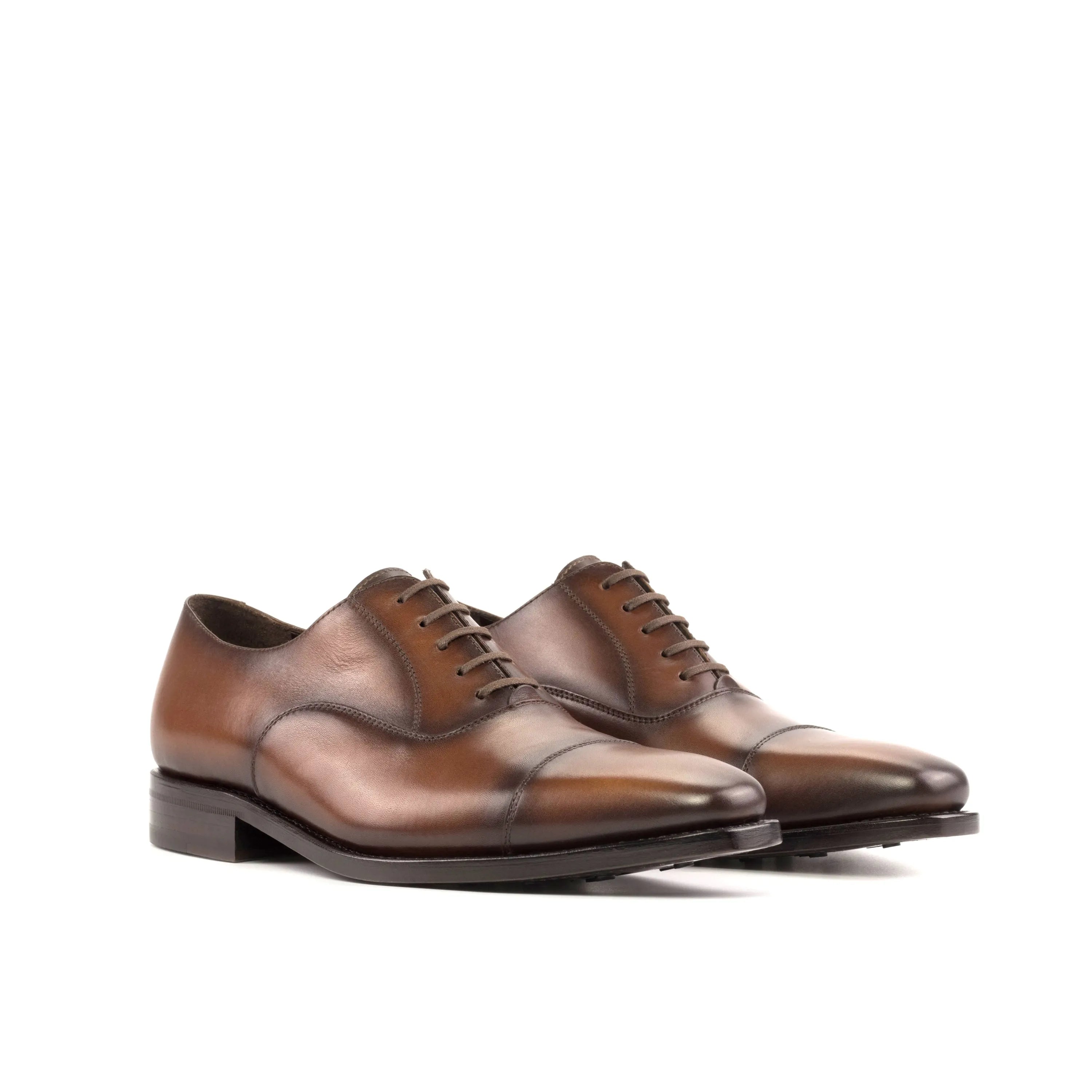Brown leather Mady Oxford shoes showcased for stylish formal wear in the fast lane