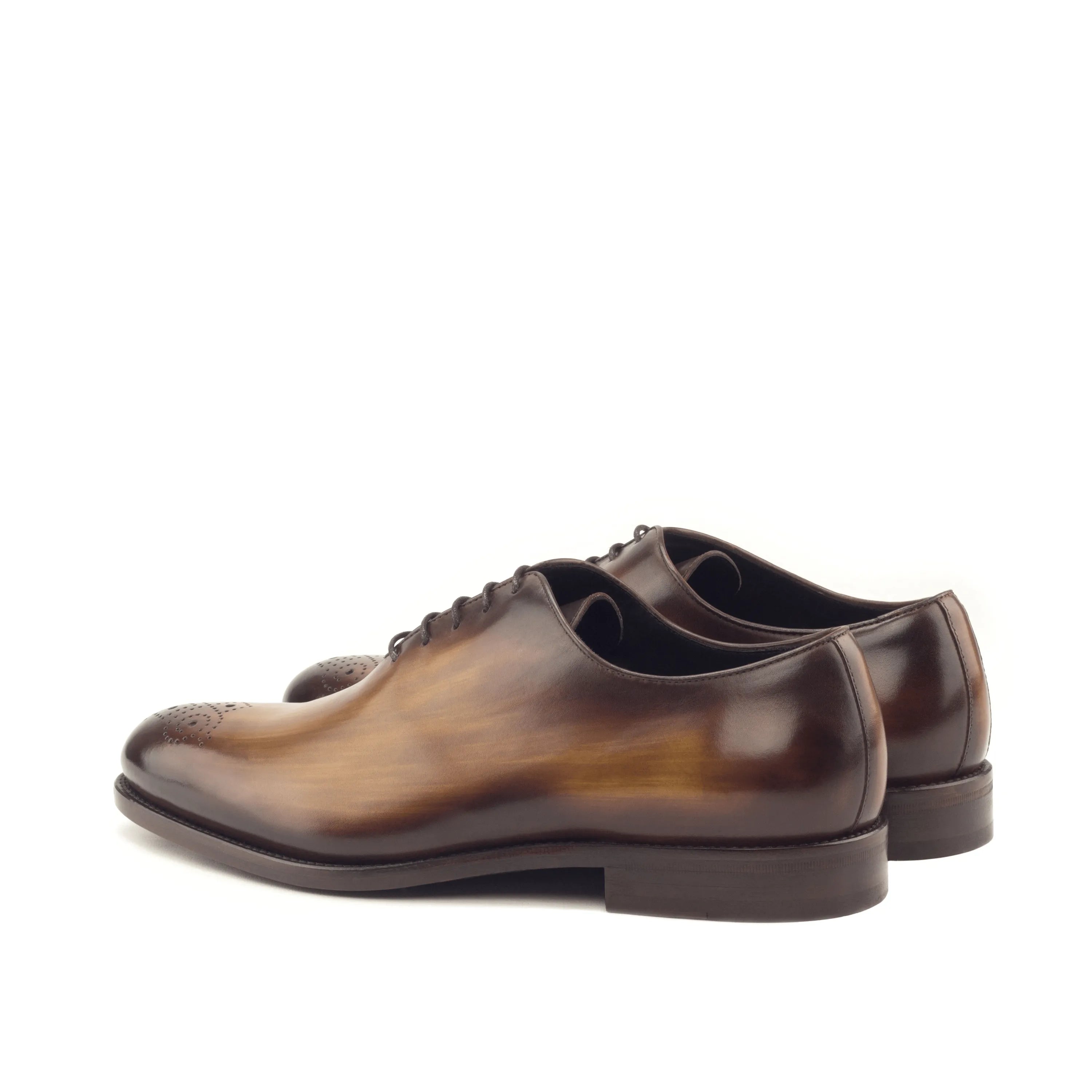 Brown leather dress shoes named Mario Whole Cut Patina, embodying luxury bespoke shoes for men