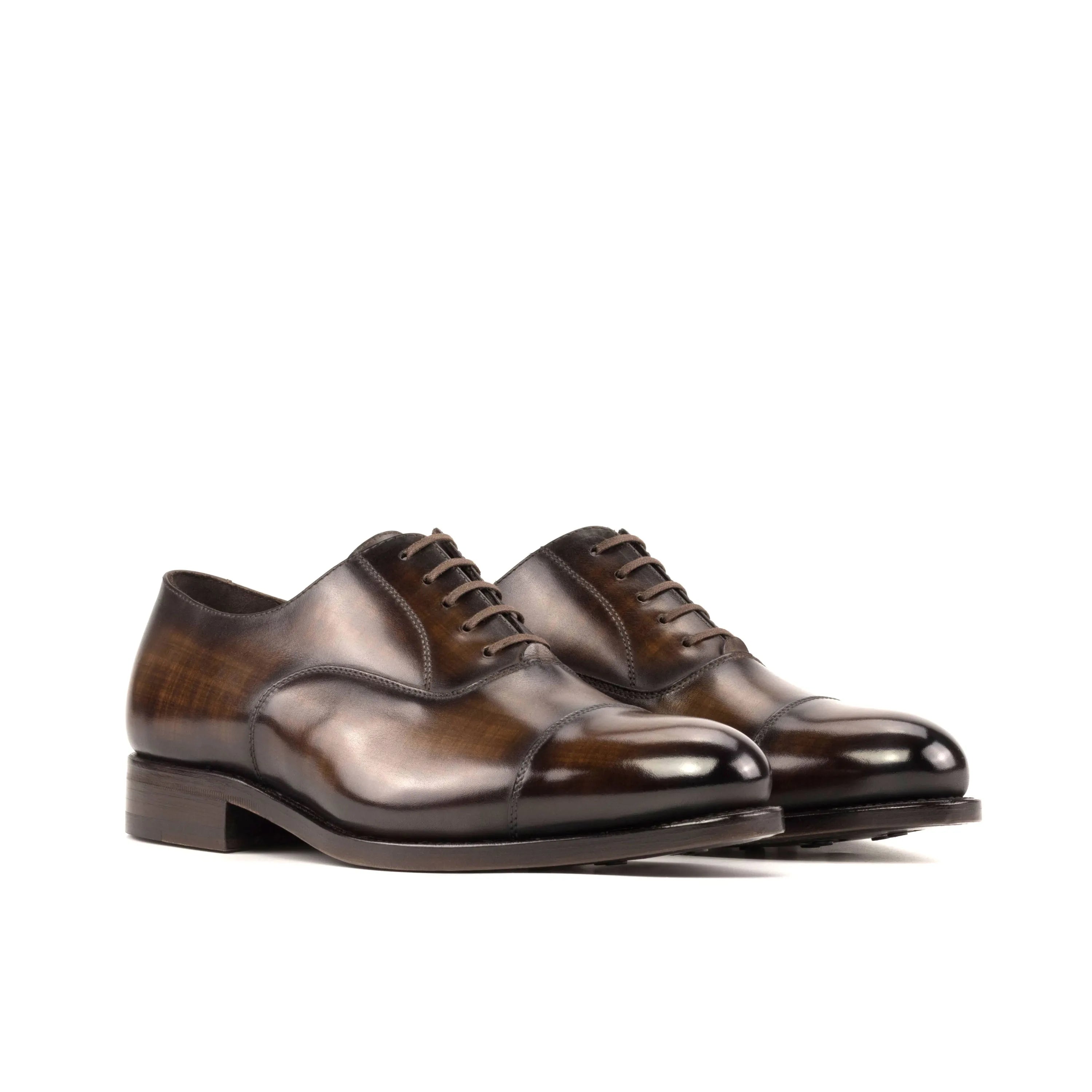 Pair of brown leather Mavrick Patina Oxford shoes showcasing elegant craftsmanship
