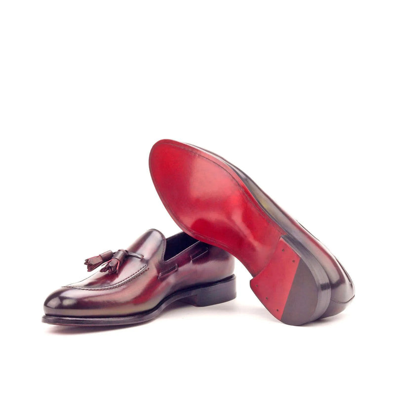 Burgundy leather MDF Patina Loafers with distinctive red soles and elegant tassel detail