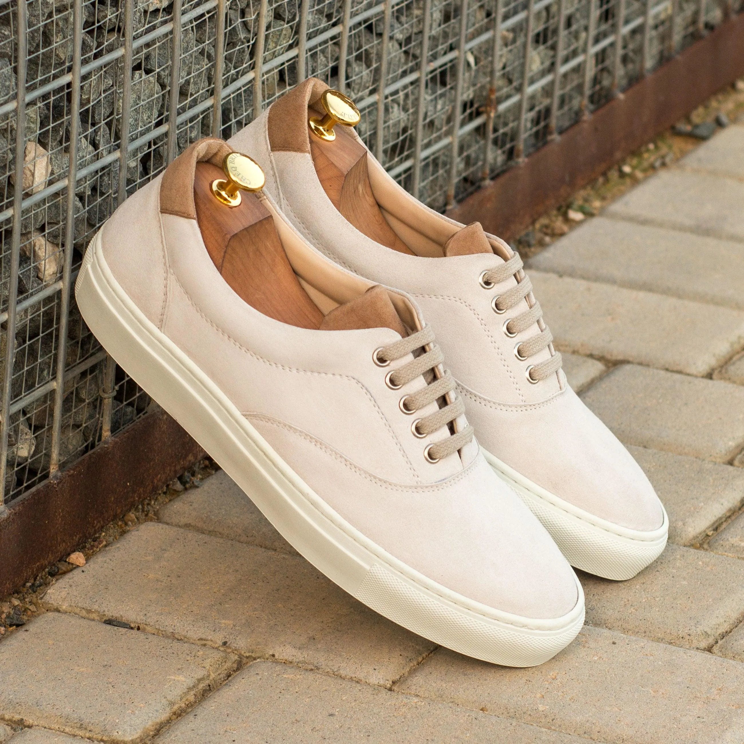 Pair of white leather Miday Top Sider Sneakers, perfect cupsole trainers for stylish wear