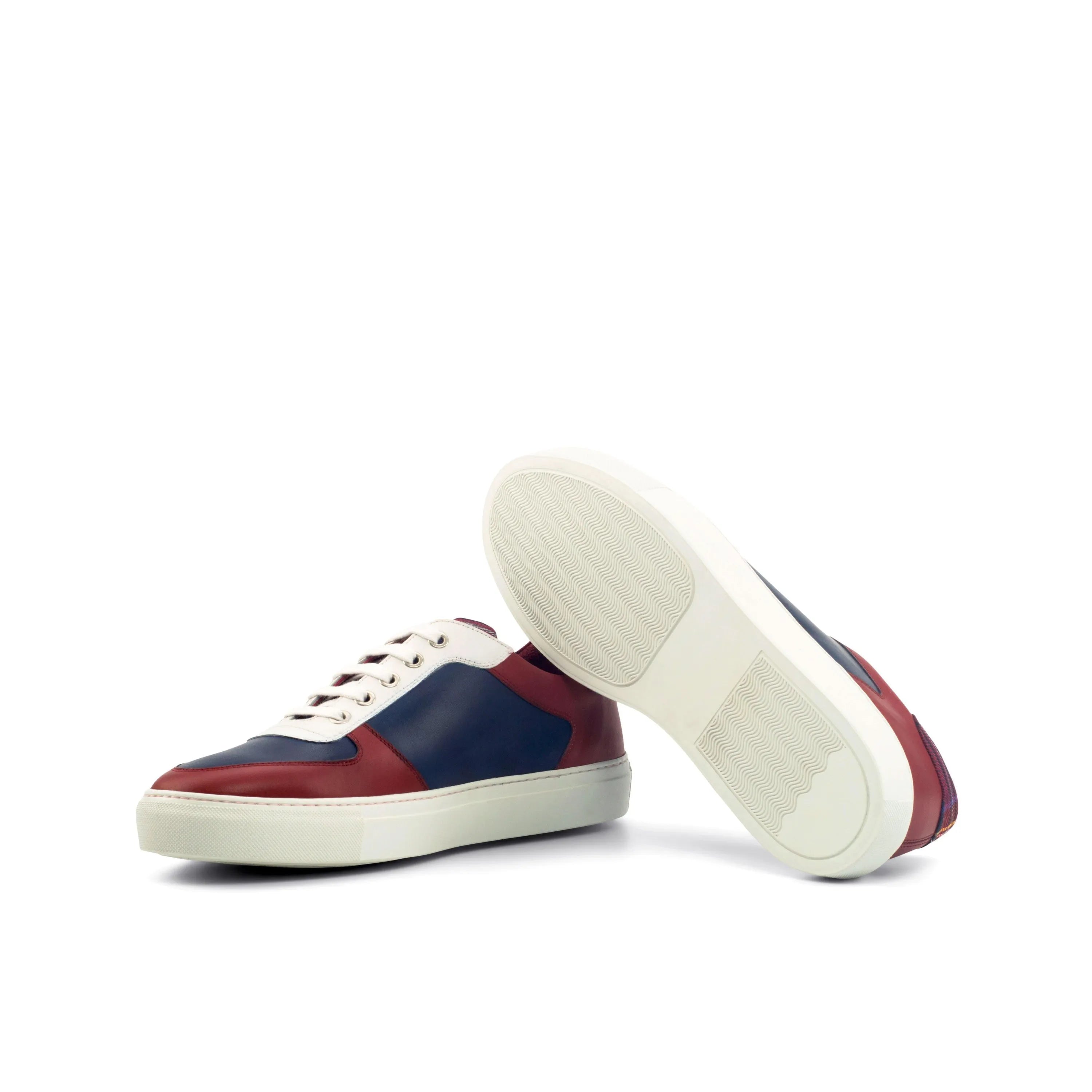 Two-toned leather sneakers featuring the Milo Low Top design and painted calf accents