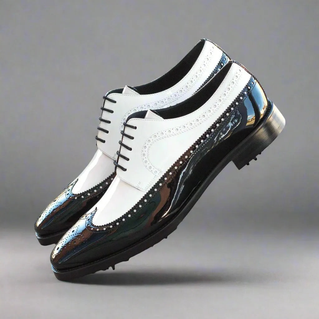 Black and white Mina Long Blucher saddle golf shoes with classic wingtip design
