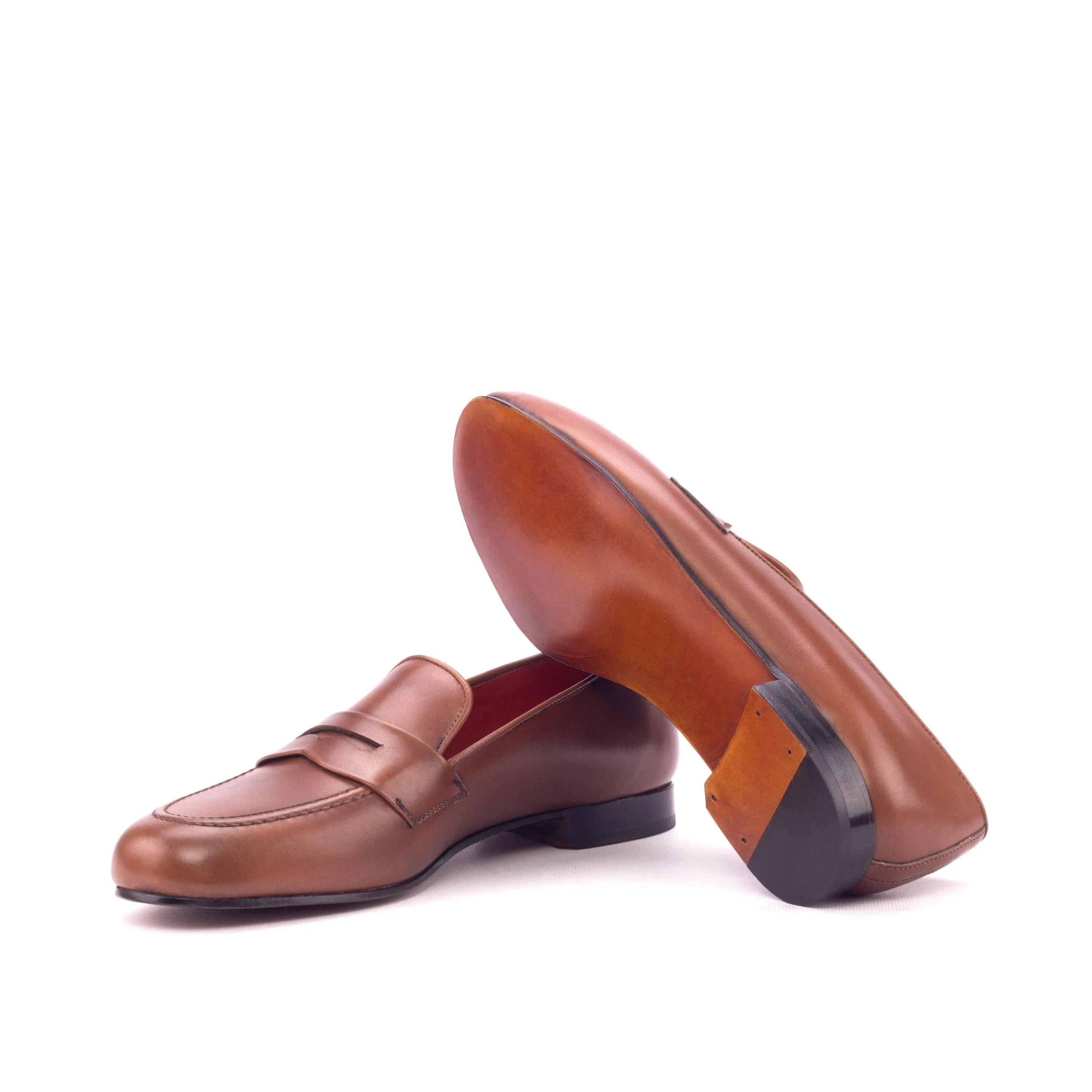 Pair of brown leather penny loafers from the Monaco Wellington slipon collection
